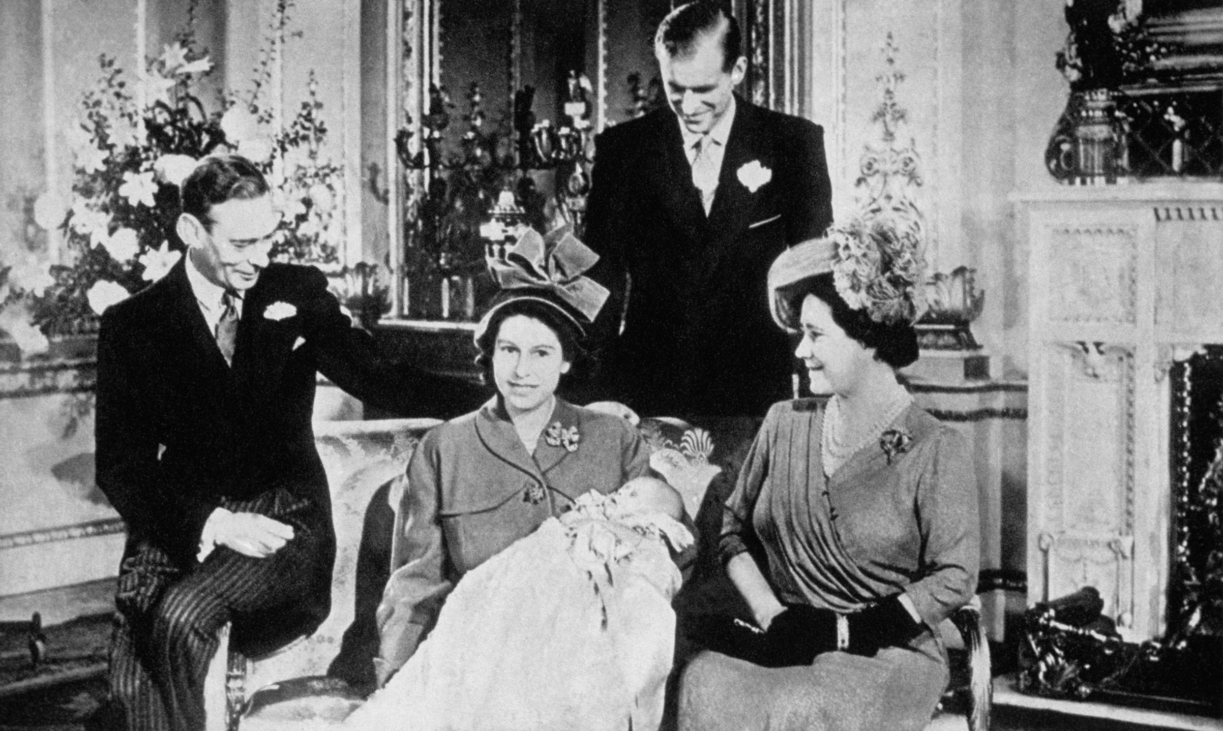 King George VI and his wife Queen Elizabeth, the Princess Elizabeth — the future Queen Elizabeth II — with the Duke of Edinborough and the infant Prince Charles. (API/Gamma-Rapho via Getty Images)