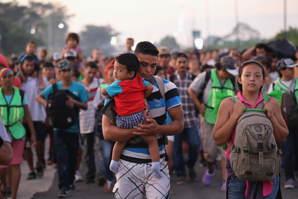 Members of a migrant caravan walk into the interior of Mexico after crossing the Guatemalan border near Ciudad Hidalgo, Mexico on Oct. 21, 2018. (John Moore&mdash;Getty Images)