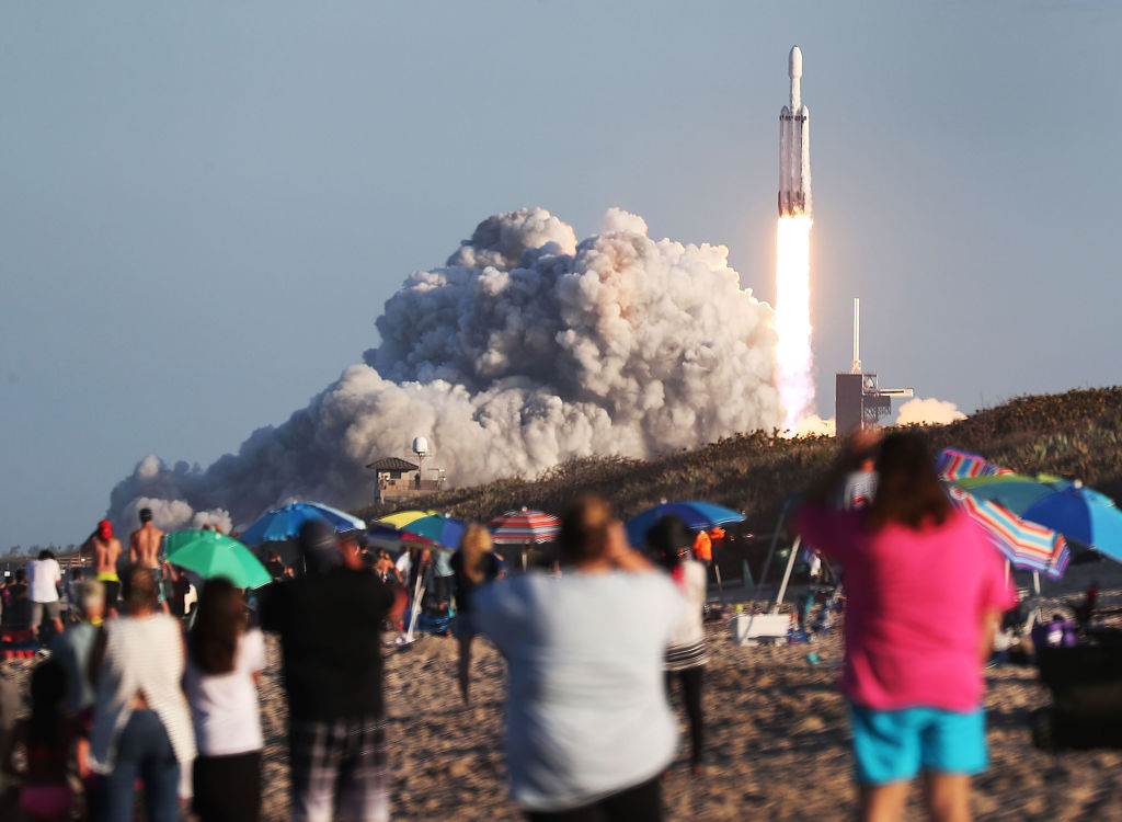 People watch as the SpaceX Falcon Heavy rocket lifts off at NASA’s Kennedy Space Center on April 11, 2019 in Titusville, Florida. (Joe Raedle&mdash;Getty Images)