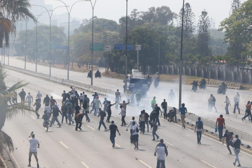 Supporters of the Venezuelan opposition leader Juan Guaido pro-coup marching near military base of La Carlota, in Caracas, Venezuela April 30, 2019
