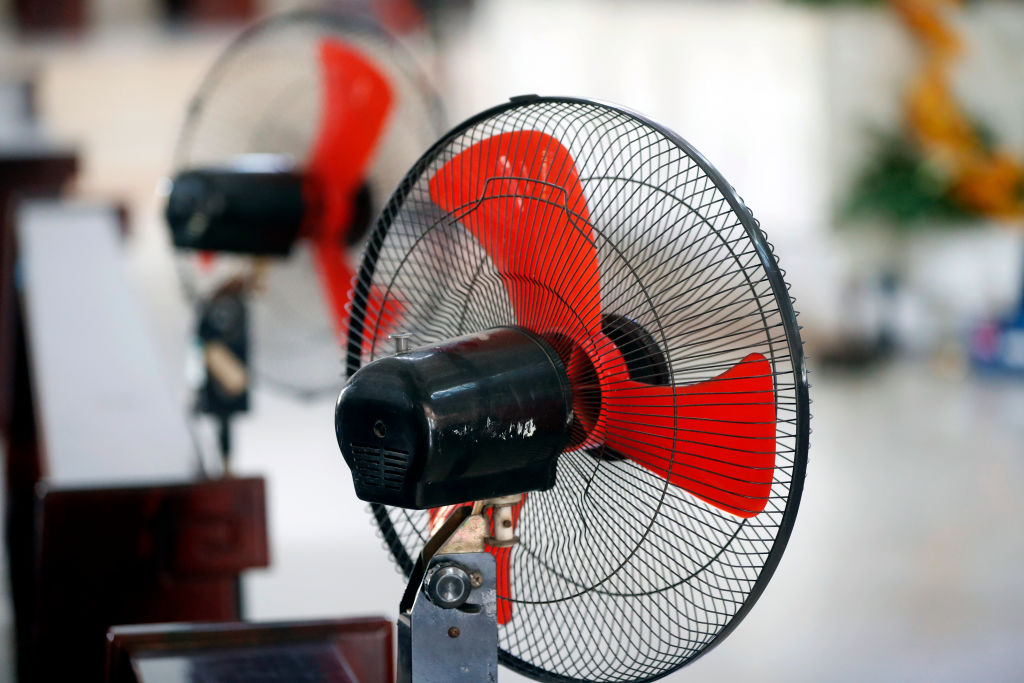 Two portable fans are seen in Ho Chi Minh City. Vietnam. (Contributor—UIG/Getty Images)