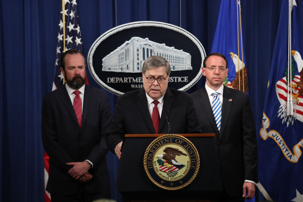 U.S. Attorney General William Barr speaks about the release of the redacted version of the Mueller report as U.S. Deputy Attorney General Rod Rosenstein and U.S. Acting Principal Associate Deputy Attorney General Ed O’Callaghan listen at the Department of Justice April 18, 2019 in Washington, DC. (Win McNamee—Getty Images)