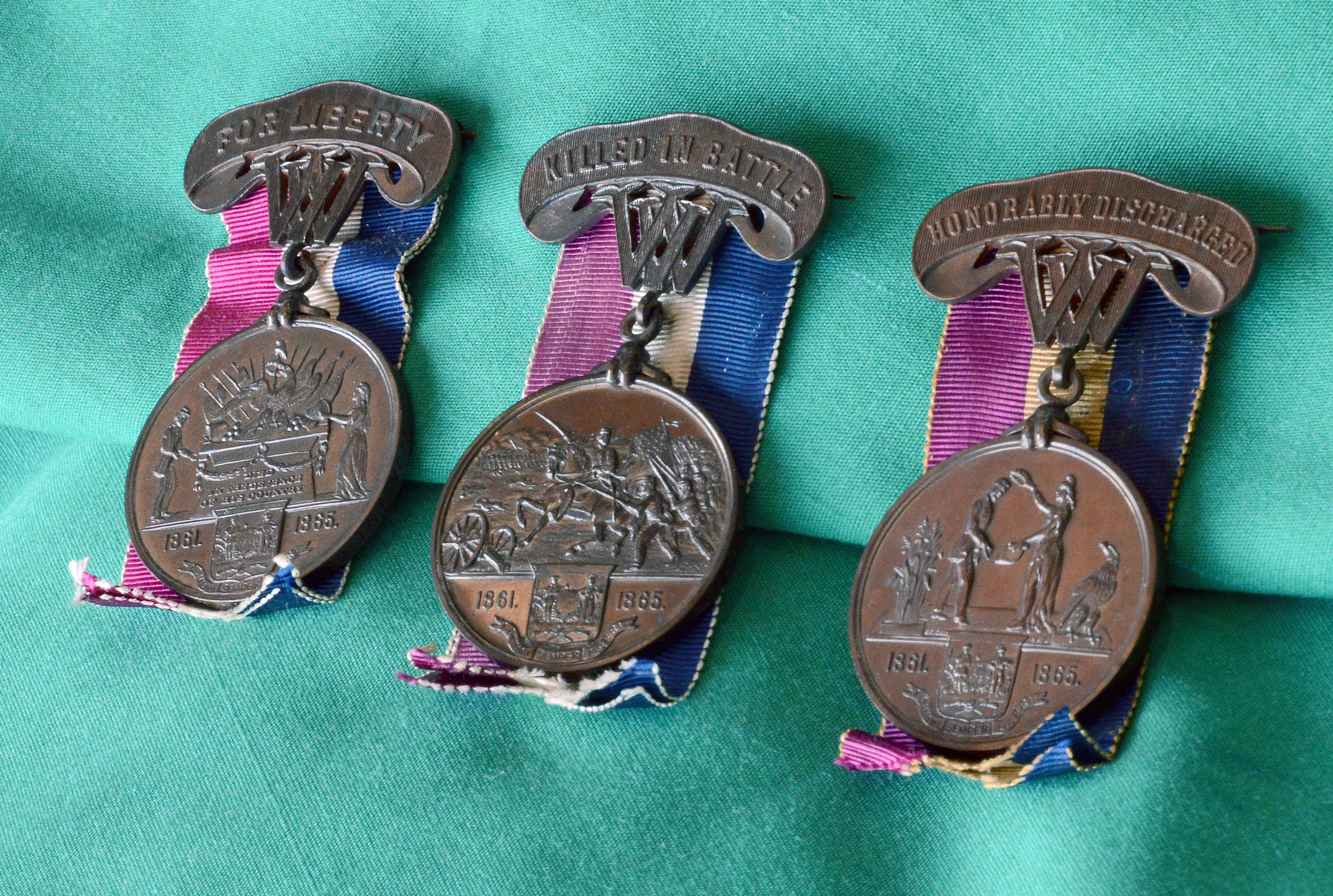 The three types of medals that West Virginia gave to Union soldiers, photographed on Apr. 11, 2019. (Steve Brightwell)