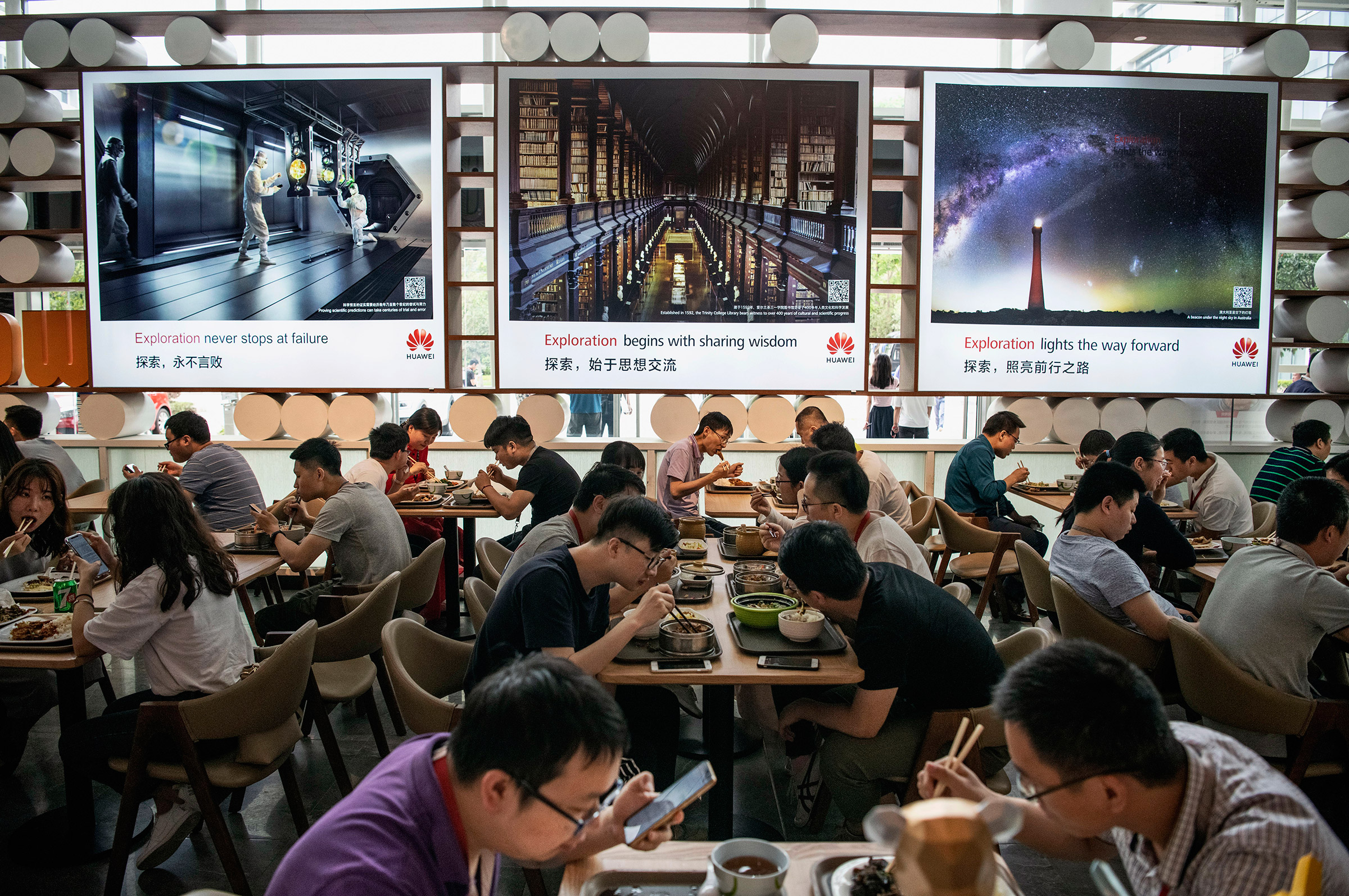 Workers eating lunch at the Huawei campus in Shenzhen, China