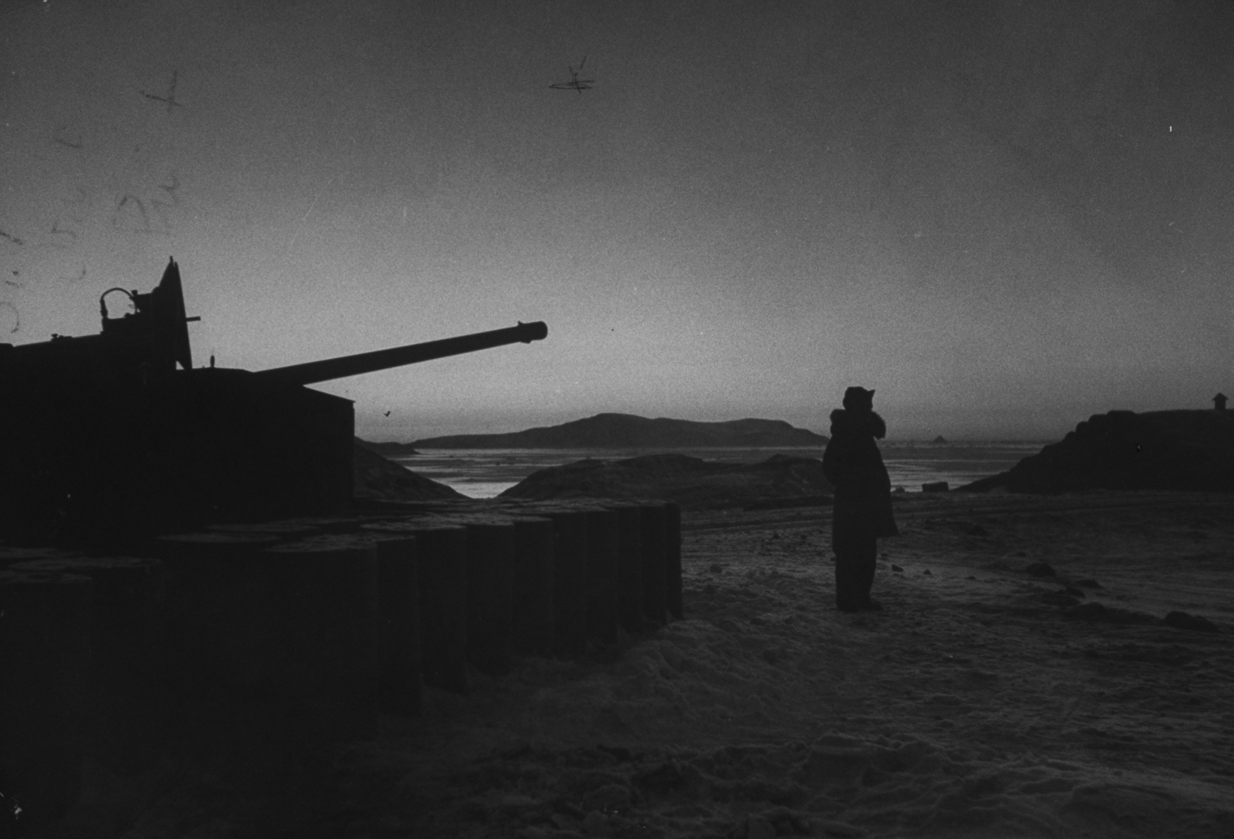 Antiaircraft gun such as this one guarded by an artilleryman in 1953 formed part of Thule Air base's intensive armament system and were manned on a 24-hour basis (George Silk—The LIFE Picture Collection/Getty)