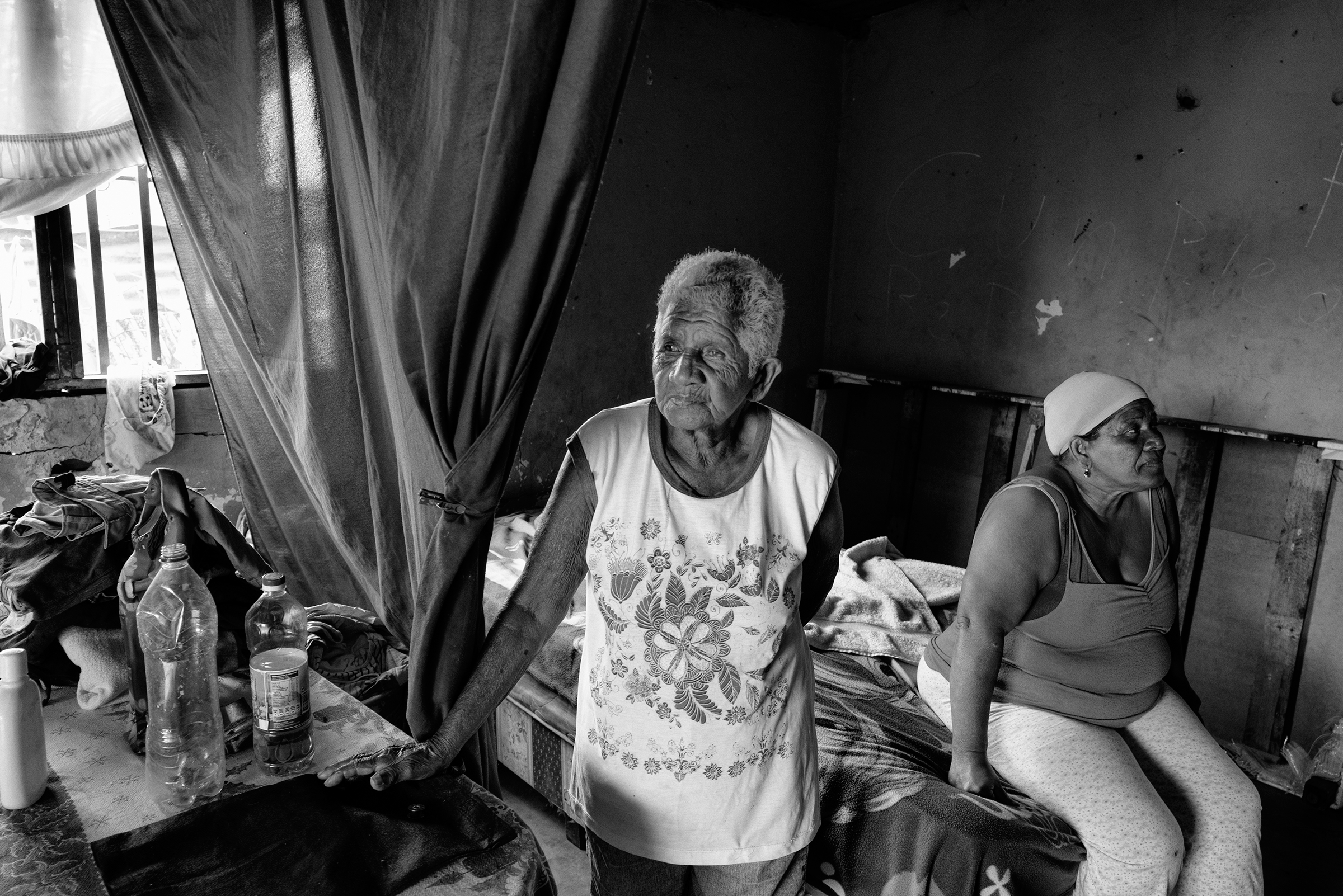 Petrona Herrera and her mother inside Herrera's house in Maracaibo in April. Three of her sons were alleged gang members who were killed by police in 2011, she says. (Alvaro Ybarra Zavala—Getty Images Reportage)
