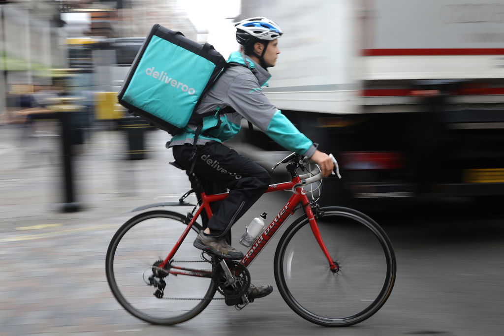 A Deliveroo rider cycles through central London in London, England on July 11, 2017. (Dan Kitwood&mdash;Getty Images)