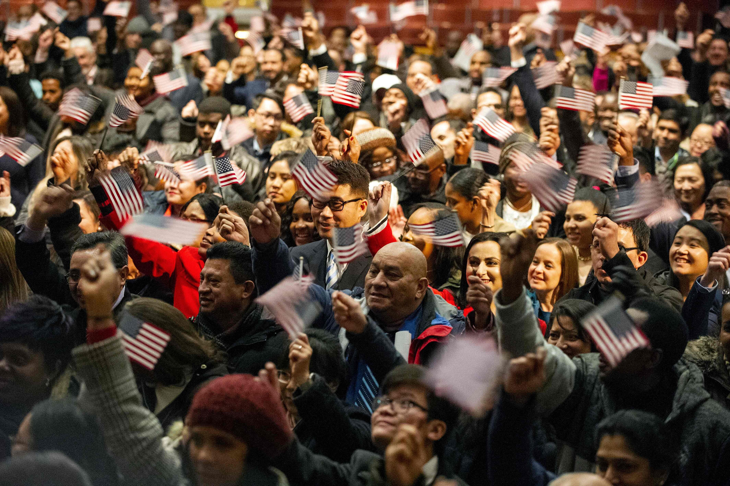 Newly sworn-in U.S. citizens on Jan. 22 in Lowell, Mass. (Joseph Prezioso—AFP/Getty Images)