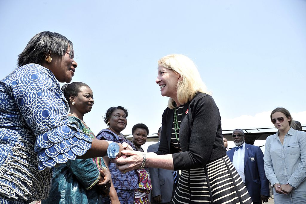 Cathy Russell, U.S. ambassador-at-large for Global Women's Issues, greets non-governmental association representatives after arriving in the Democratic Republic of Congo on July 5, 2014. (JUNIOR D. KANNAH&mdash;AFP/Getty Images)