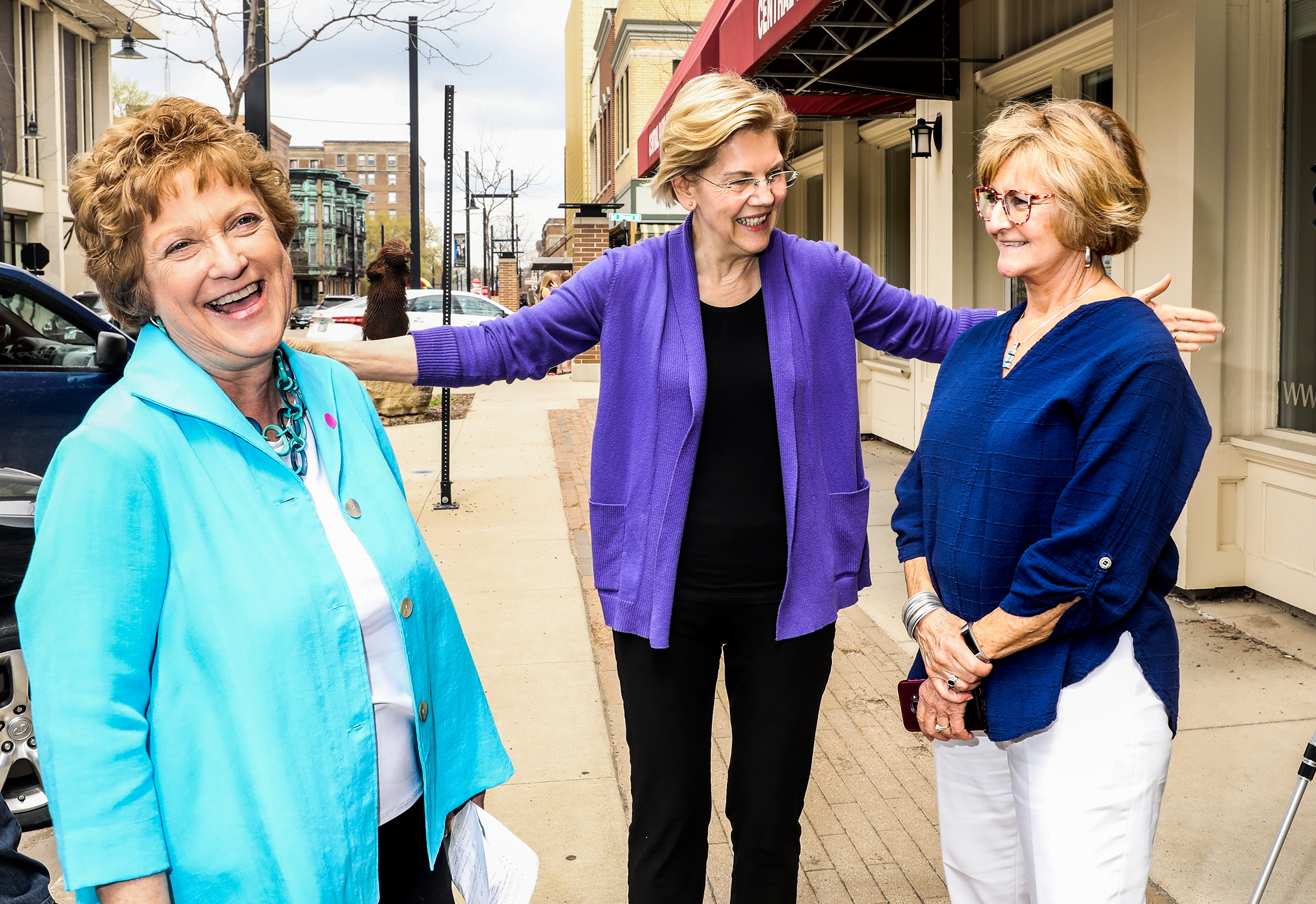 From left to right: State Senator Amanda Ragan, Warren and State Representative Sharon Steckman outside a meet and greet in Mason City, Iowa, on May 4. (Krista Schlueter for TIME)