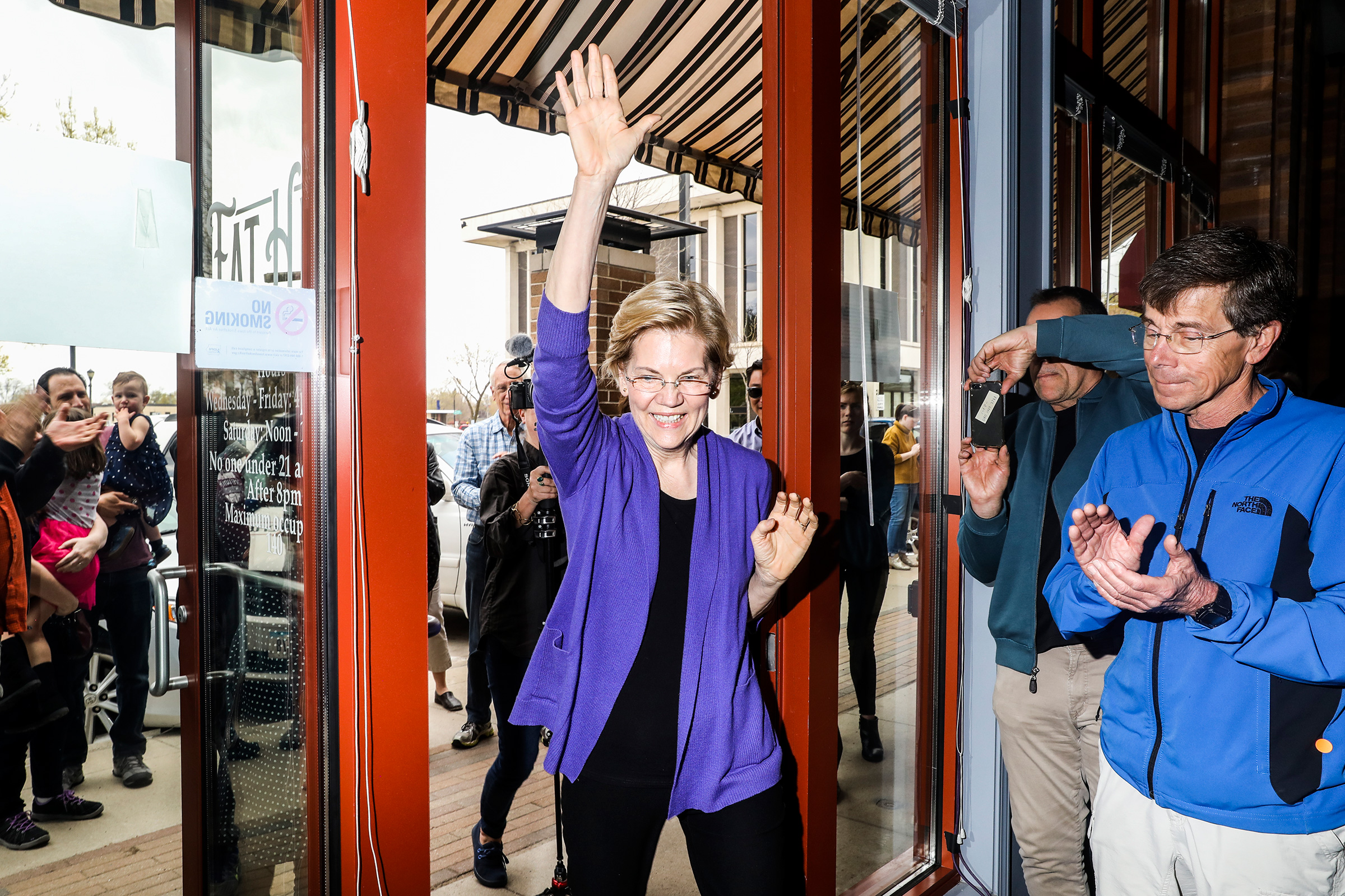 Warren walks into an event at Fat Hill Brewing in Mason City on May 4. (Krista Schlueter for TIME)
