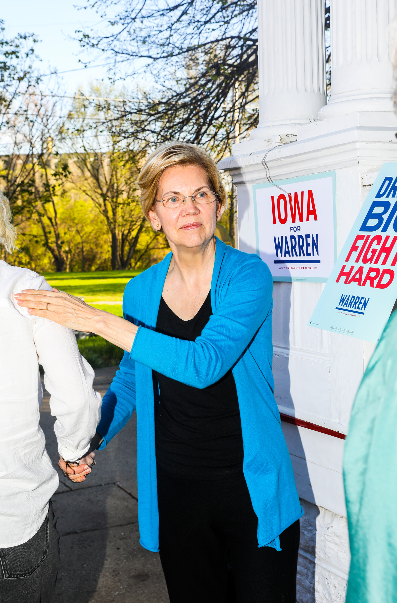 Warren greets supporters at a house party in Iowa Falls on May 3. (Krista Schlueter for TIME)