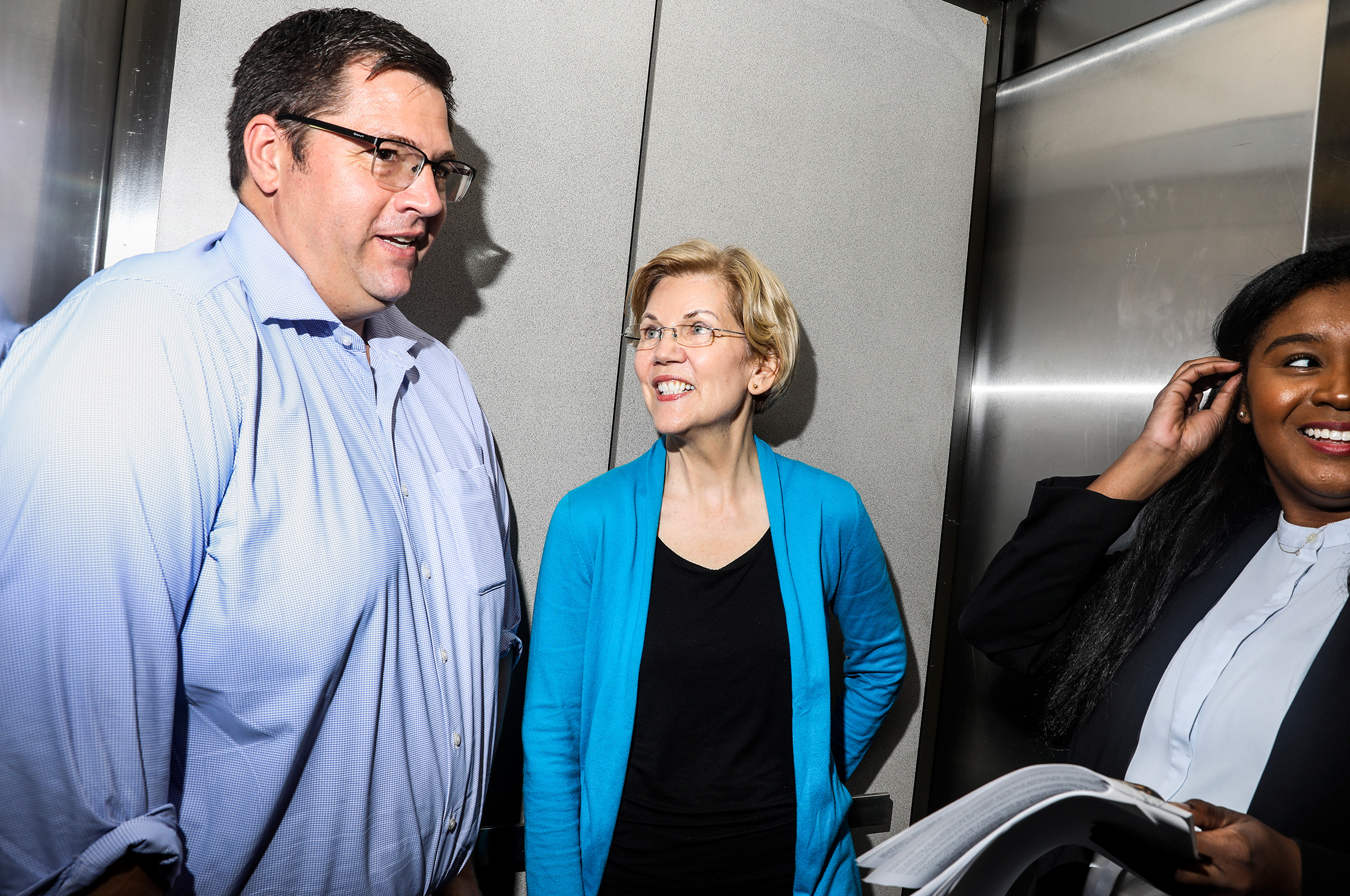 Warren and her son, Alex, in the elevator on the way up to an organizing event at Iowa State University on May 3. (Krista Schlueter for TIME)