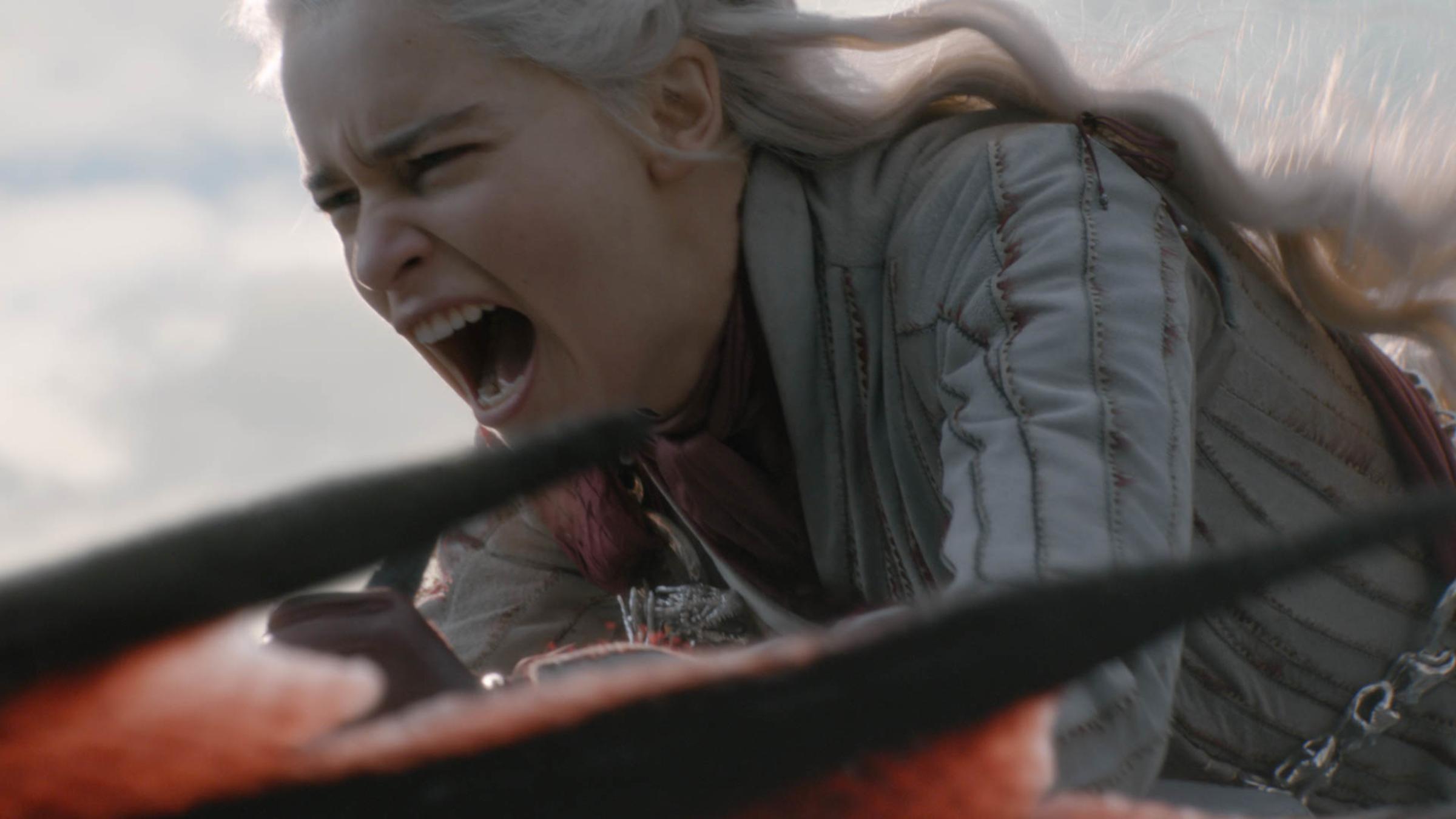 Daenerys rides a dragon during an attack on Game of Thrones