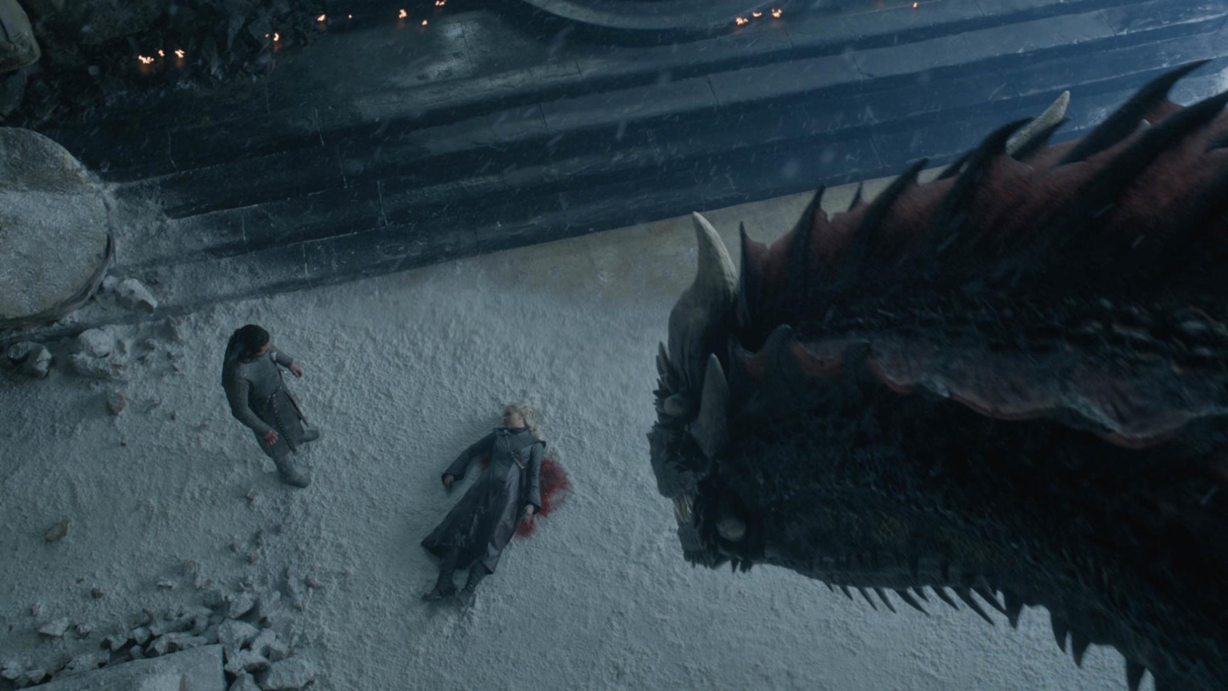 Aerial shot of Dragon looking at Jon Snow over Daenerys' dead body on Game of Thrones' series finale