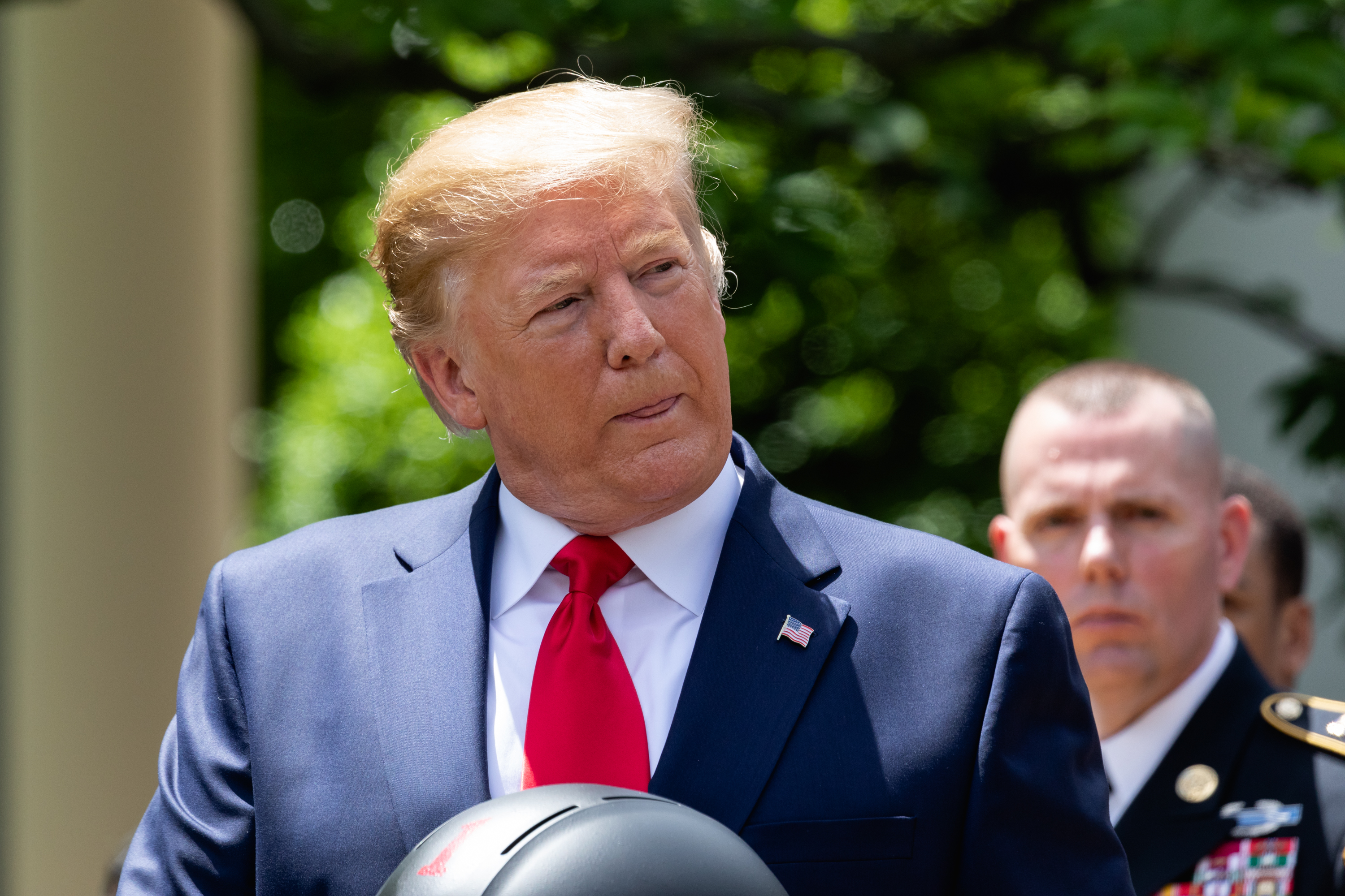 President Donald Trump listens during the presentation of the Commander-in-Chief's Trophy to the U.S. Military Academy football team, the Army Black Knights, in the Rose Garden of the White House in Washington, D.C., on Monday, May 6, 2019. (Cheriss May—NurPhoto via Getty Images)