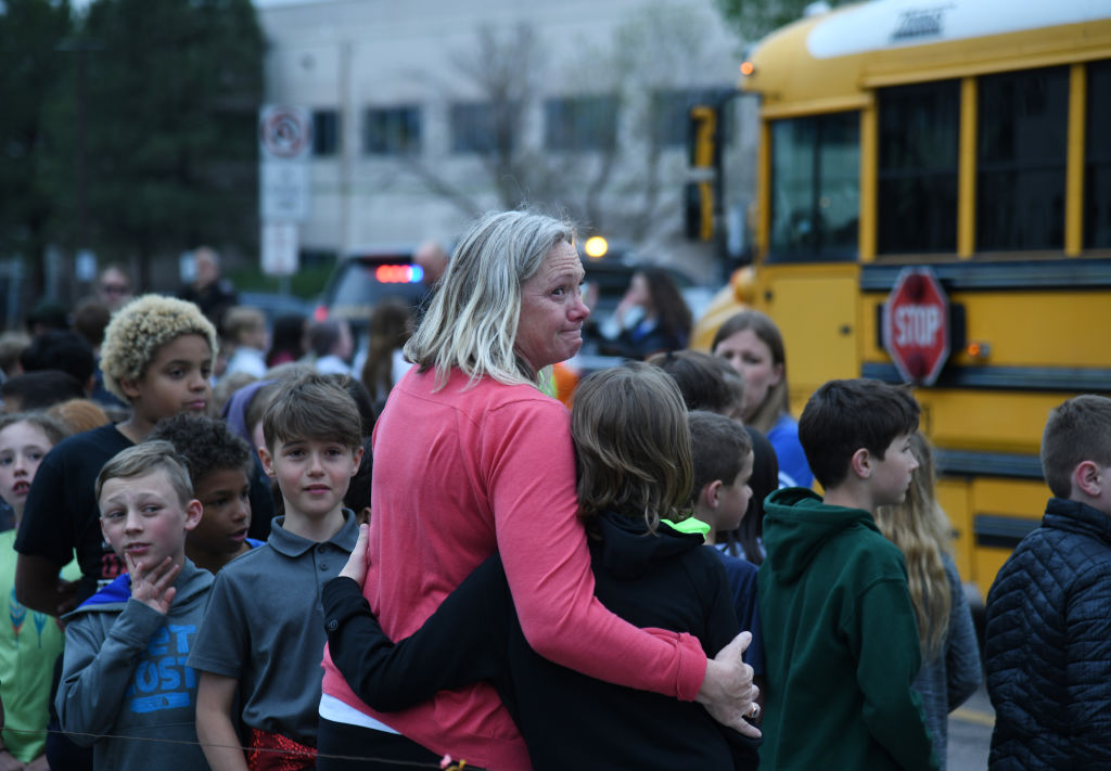 Students escorted on school bus in front of STEM School Highlands Ranch after a shooting. May 7, 2019. (Hyoung Chang/MediaNews Group/The—Denver Post via Getty Images)