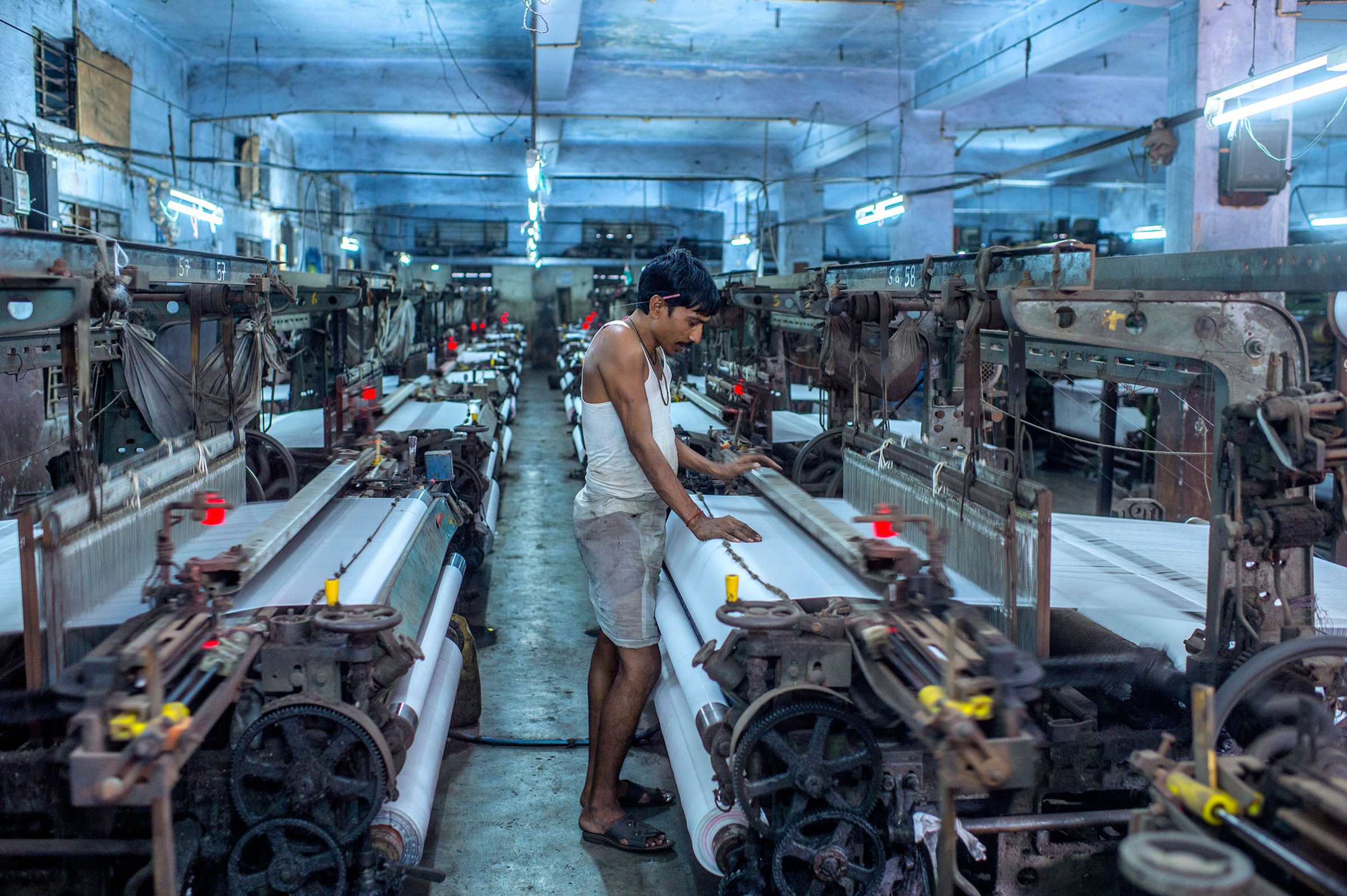 Umakant Sharma works the looms in Surat, India
