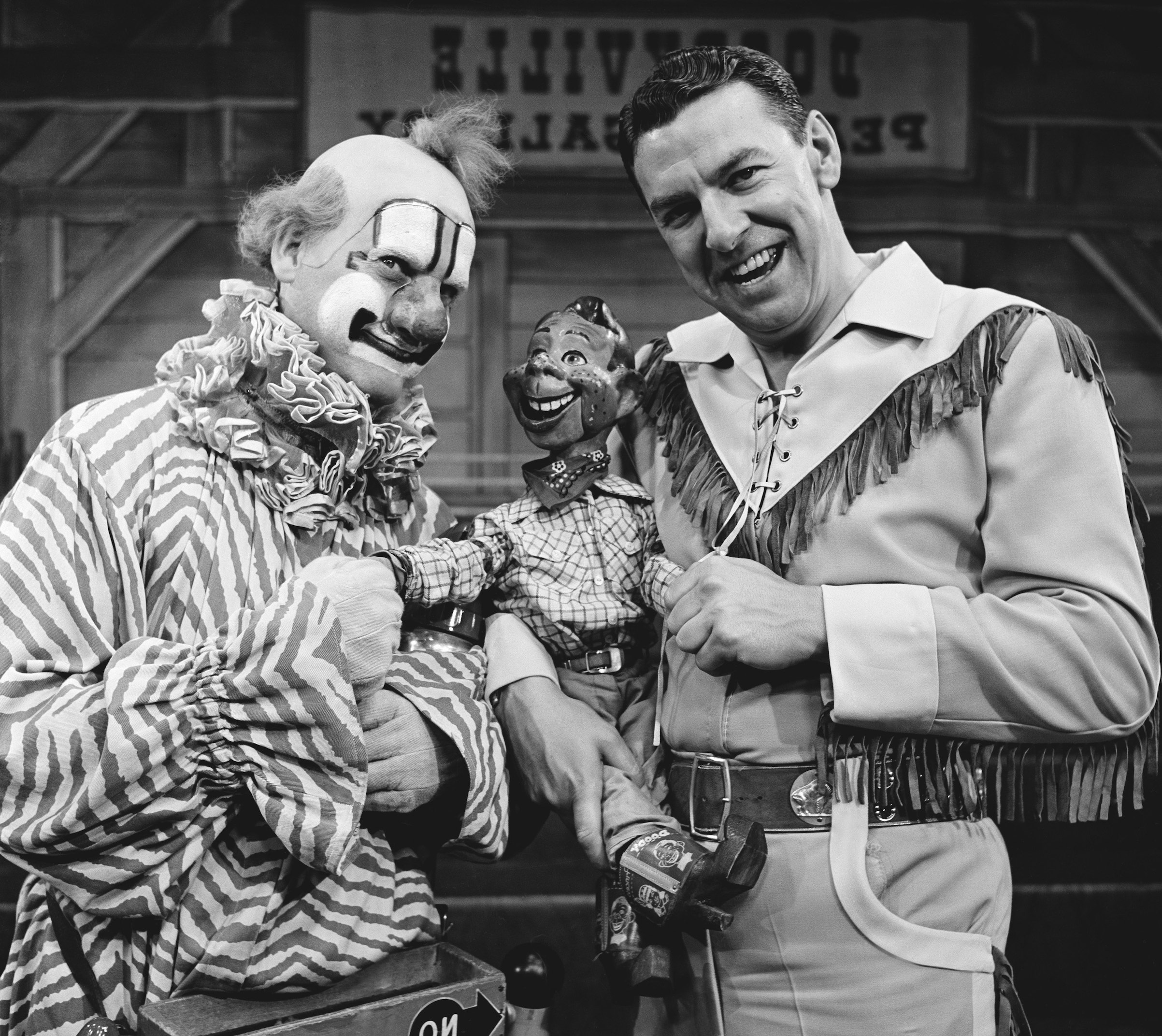 Pictured: (l-r) Lew Anderson as Clarabell the Clown, Howdy Doody, Bob Smith as Buffalo Bob Smith (NBC/Getty Images)