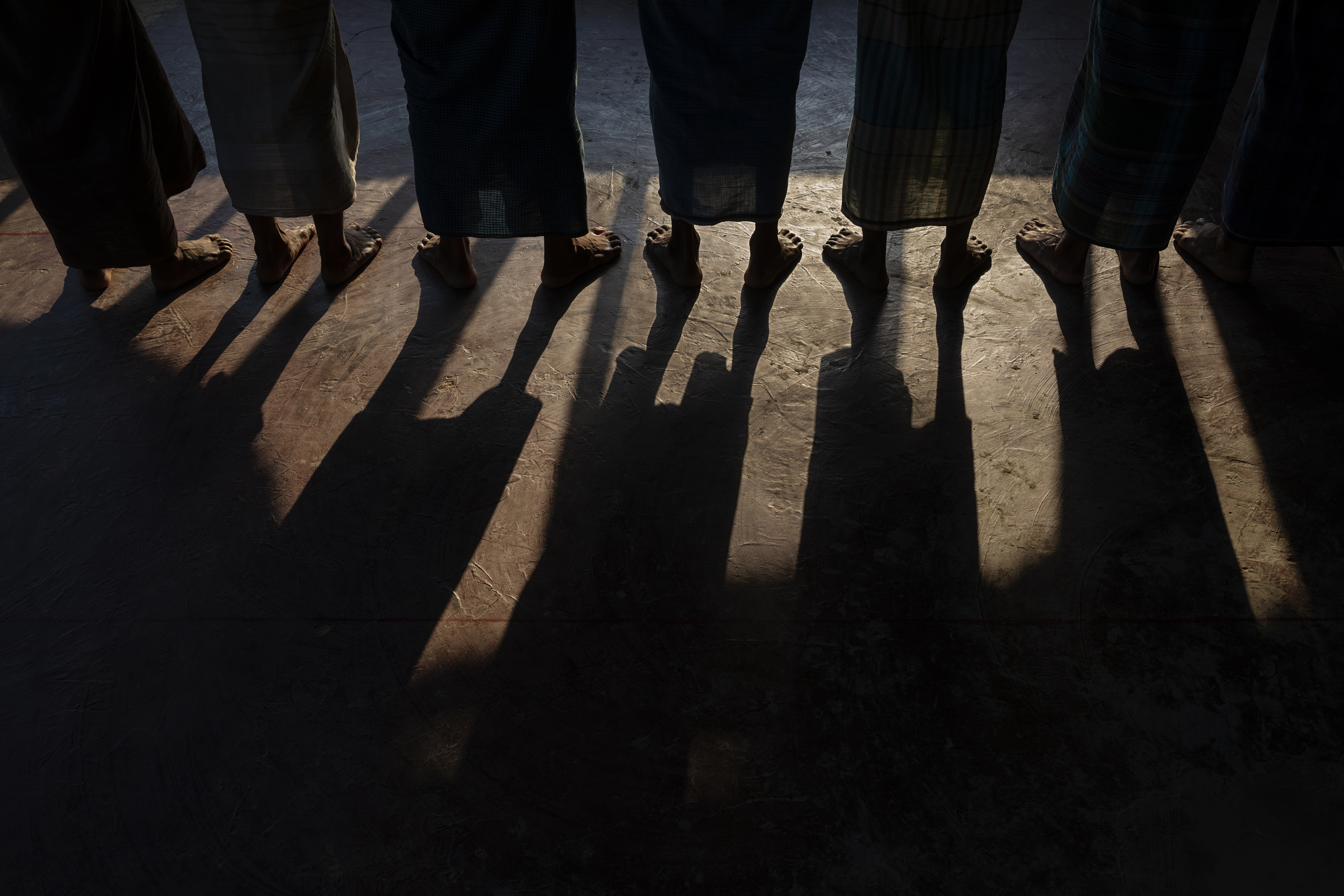 Men stand during afternoon prayers at a mosque. (James Nachtwey for TIME)