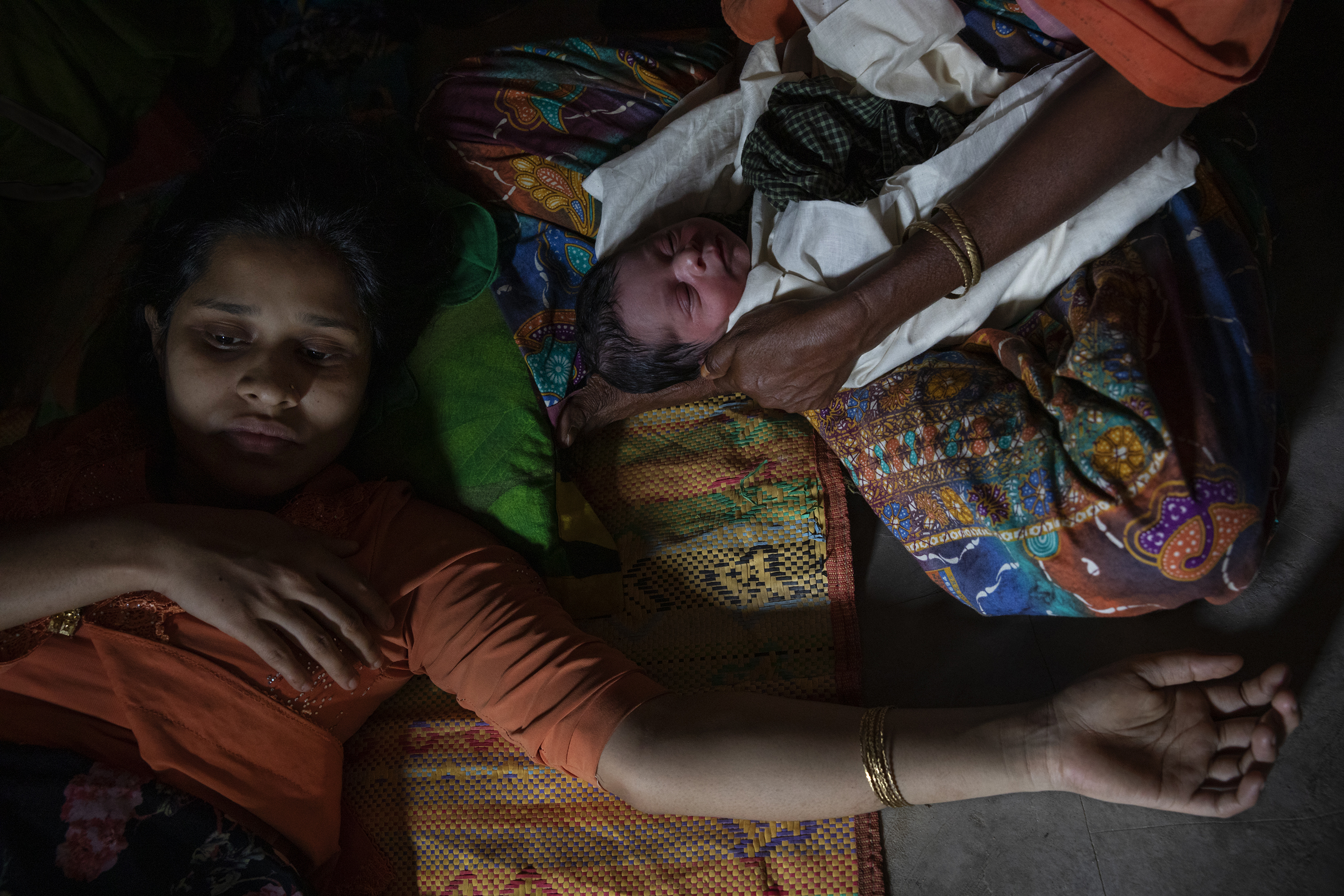Umme Habiba, 18, following the birth of her daughter, Zahra. (James Nachtwey for TIME)