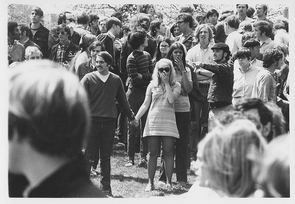 On Blanket Hill, Kent State University students, several with hands over their mouths, stare in the aftermath of the Ohio National Guard having opened fire on their antiwar demonstration, Kent, Ohio, May 4, 1970. (Howard Ruffner—Getty Images)