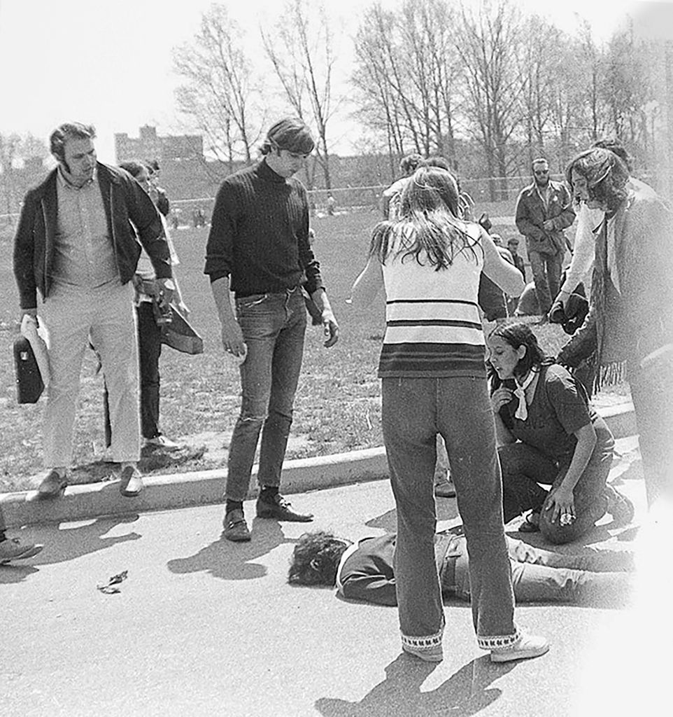Teenager Mary Ann Vecchio (kneeling, with white neckerchief) and others surround the body of Kent State University student Jeffrey Miller (1950 - 1970) who had been shot during an anti-war demonstration on the university campus, Kent, Ohio, May 4, 1970. The protests, initially over the US invasion of Cambodia, resulted in the deaths of four students, including Miller, and the injuries of nine others after the National Guard opened fire on students. Vecchio (who was not a KSU student) was also photographed in the Pulitzer prize-winning photograph (also by John Filo) that came to define the event. (John Filo&mdash;Getty Images)