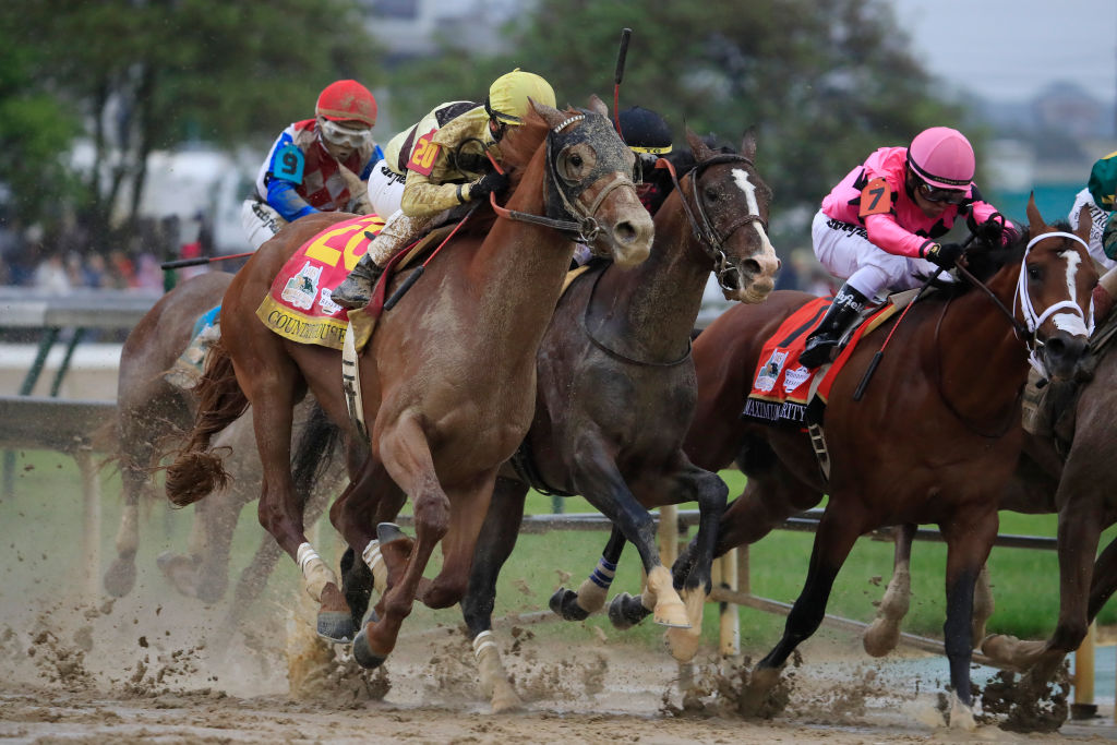 Country House #20, ridden by jockey Flavien Prat, War of Will #1, ridden by jockey Tyler Gaffalione , and Maximum Security #7, ridden by jockey Luis Saez fight for position in the final turn during the 145th running of the Kentucky Derby at Churchill Downs on May 04, 2019 in Louisville, Kentucky. (Andy Lyons&mdash;Getty Images)