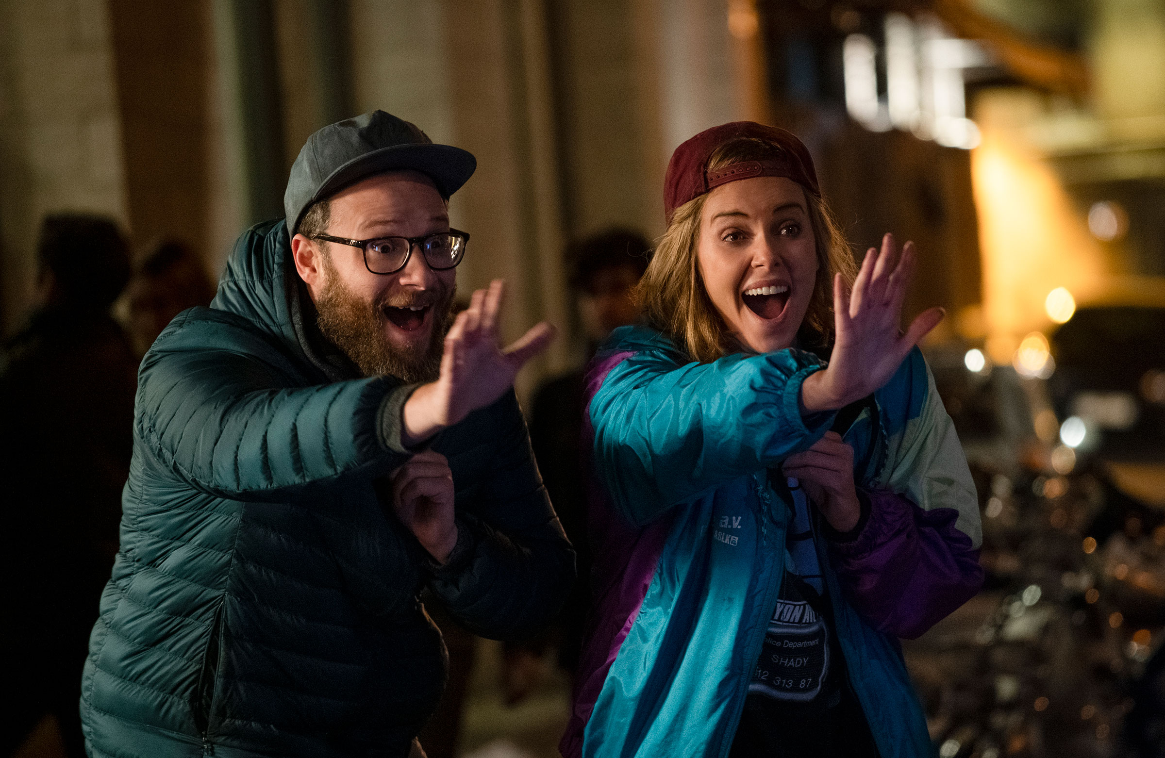 Rogen and Theron keep democracy alive (Philippe Bosse—Lionsgate)
