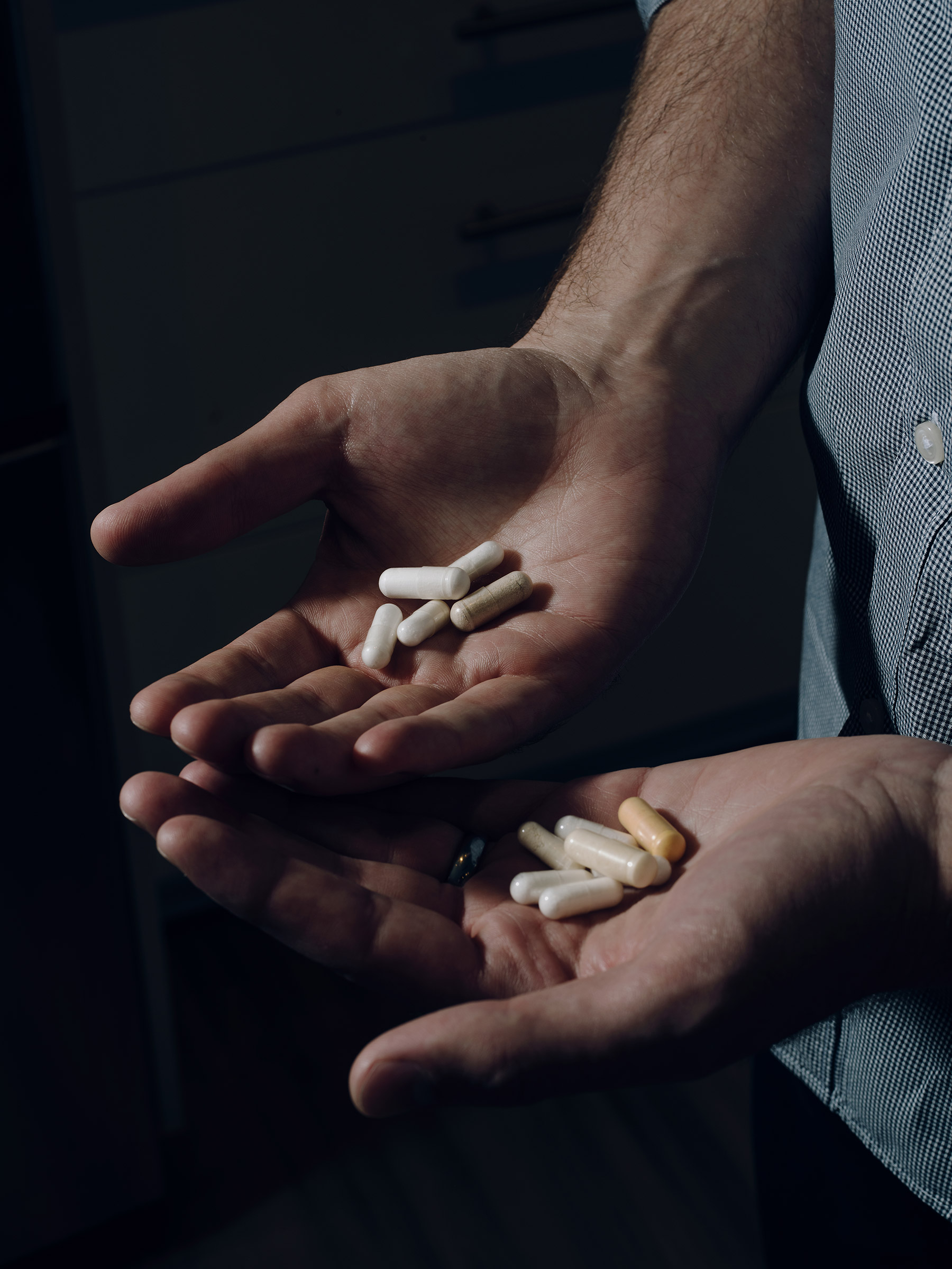 To keep his blood lead levels low, Virginia Tech shooting survivor Colin Goddard has to swallow 31 pills a day as part of his chelation treatment, a chemical process used to rid the body of excess or toxic metals. (Bryan Thomas for TIME)