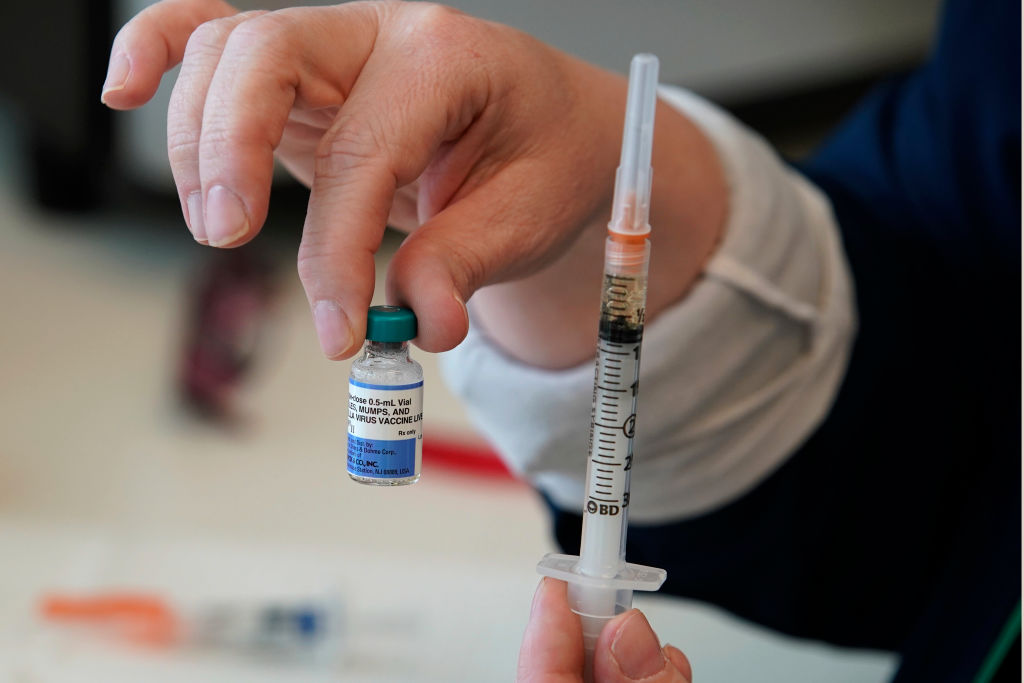 A nurse holds up a one dose bottle and a prepared syringe of measles, mumps and rubella virus vaccine made by Merck at the Utah County Health Department on April 29, 2019 in Provo, Utah. (George Frey&mdash;Getty Images)