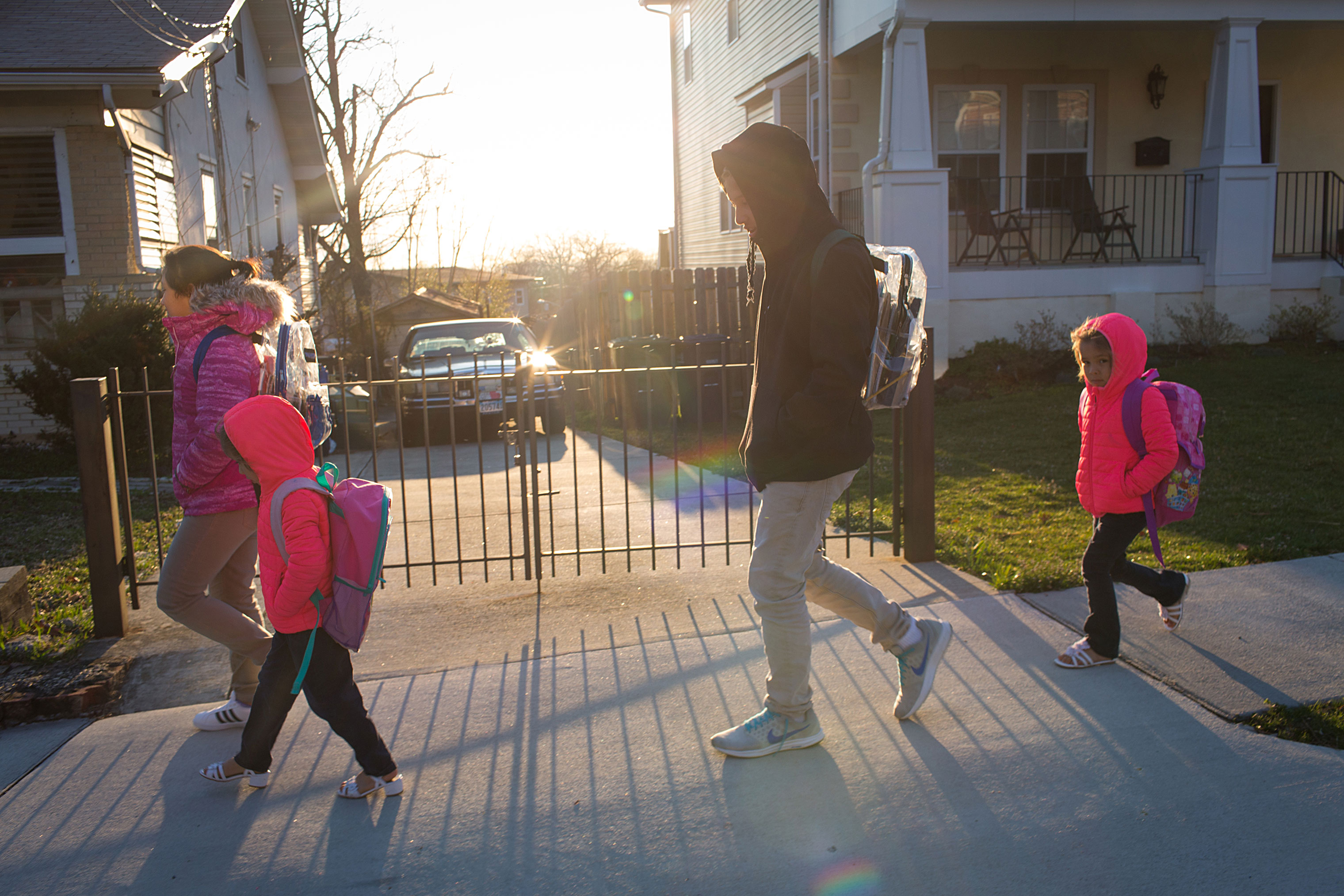 From left, Jeimy, 13, Sayra, 5, Victor, 15, and Cheyli, 5, walk to school on March 25. (Federica Valabrega)