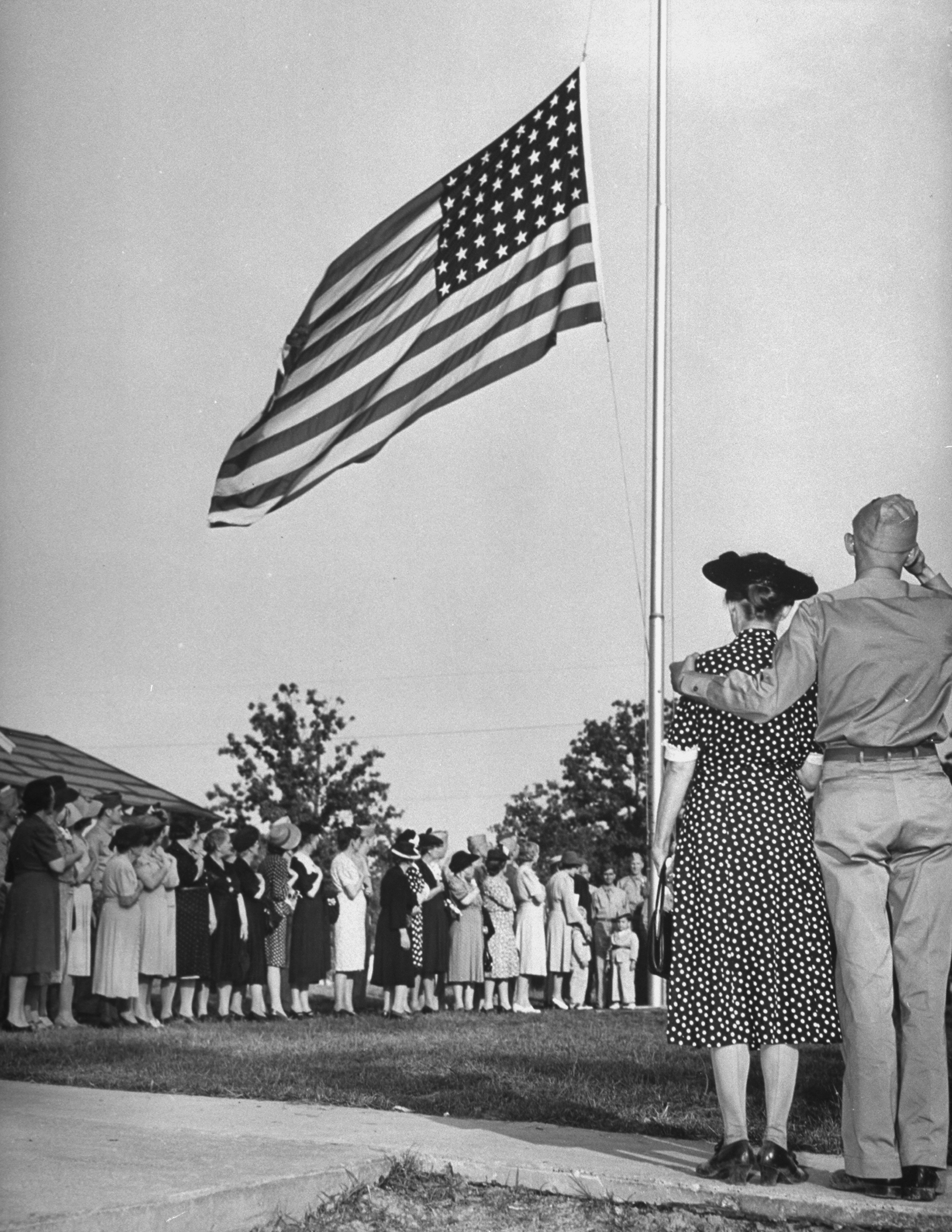 Mothers standing in line near the American flag during the crowing ceremonies of Mother's Day on a U.S. Army base. 1942. (William C. Shrout—The LIFE Picture Collection/Getty Images)