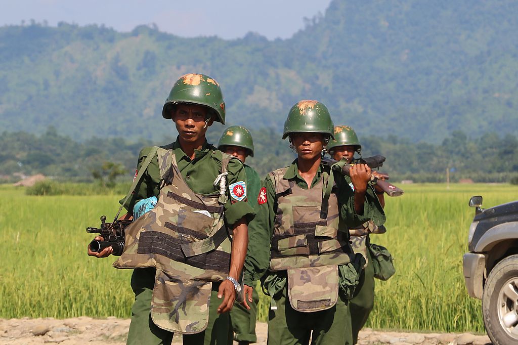 Armed Myanmar soldiers patrol a village in Maungdaw located in Myanmar's Rakhine State on Oct. 21, 2016. (STR/AFP/Getty Images)
