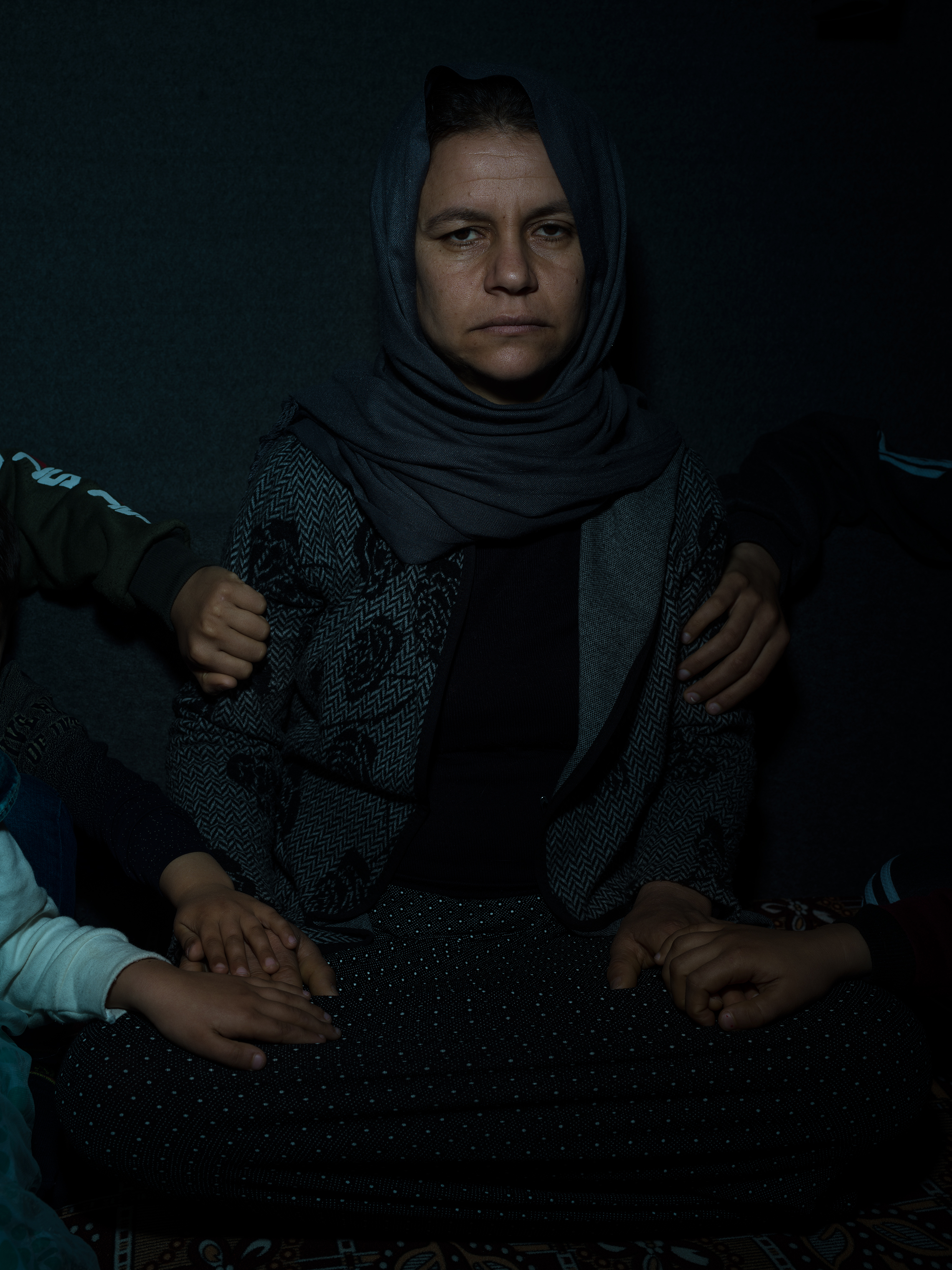 Subha, 35, and the hands of her children: Fahad, 15; Fahdi, 13; Linda, 10; Liza, 7; and Salam, 5. Photographed in February, they were captured by ISIS in 2014 and held as slaves until recently escaping the battle in Baghouz. Fahad, who had been trained as a fighter, led the way to safety. (Newsha Tavakolian—Magnum Photos for TIME)
