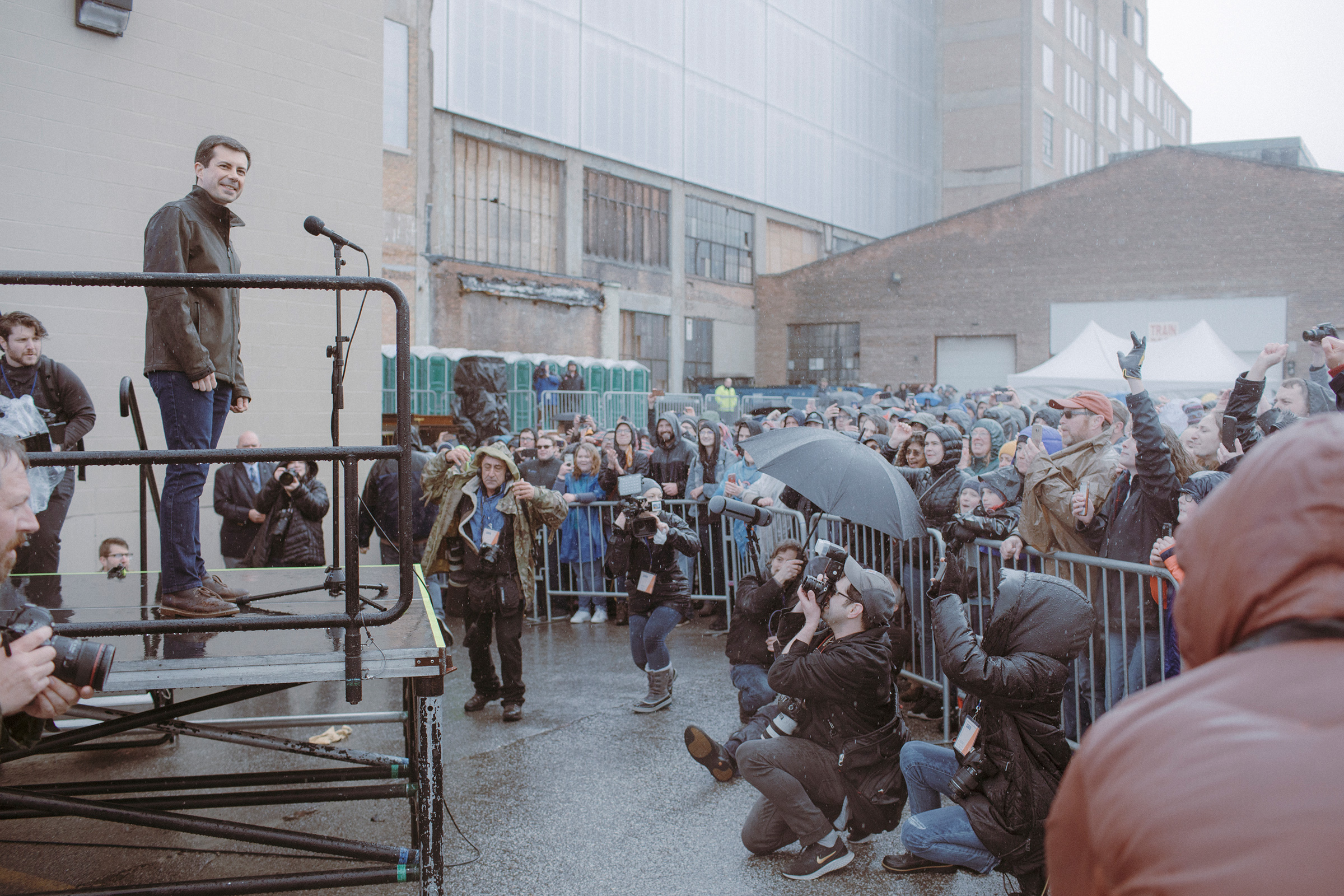 Mayor Pete Buttigieg greets the overflow crowd of supporters waiting in the rain on April 14 outside his presidential campaign announcement in South Bend. (Elliot Ross for TIME)