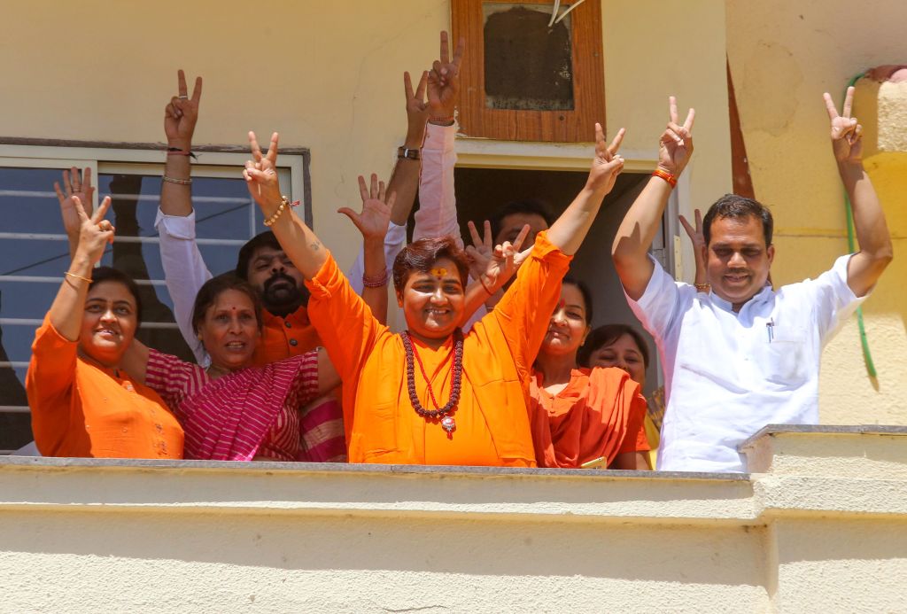 Indian Bharatiya Janata Party (BJP) candidate Pragya Singh Thakur, known as Sadhvi Pragya, gestures along with other BPJ supporters on the vote results day for India's general election at her residence in Bhopal on May 23, 2019. (Gagan Nayar—AFP/Getty Images)