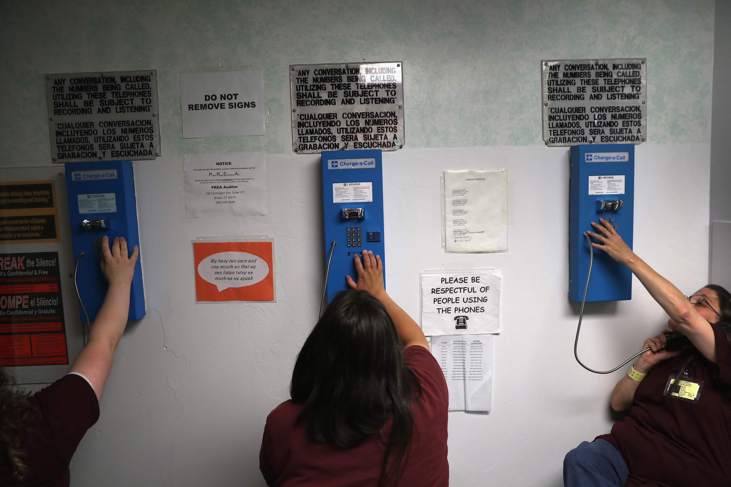 Prison inmates make one of their daily allotment of six phone calls at the York Community Reintegration Center on May 24, 2016, in Niantic, Connecticut. (John Moore/Getty Images)