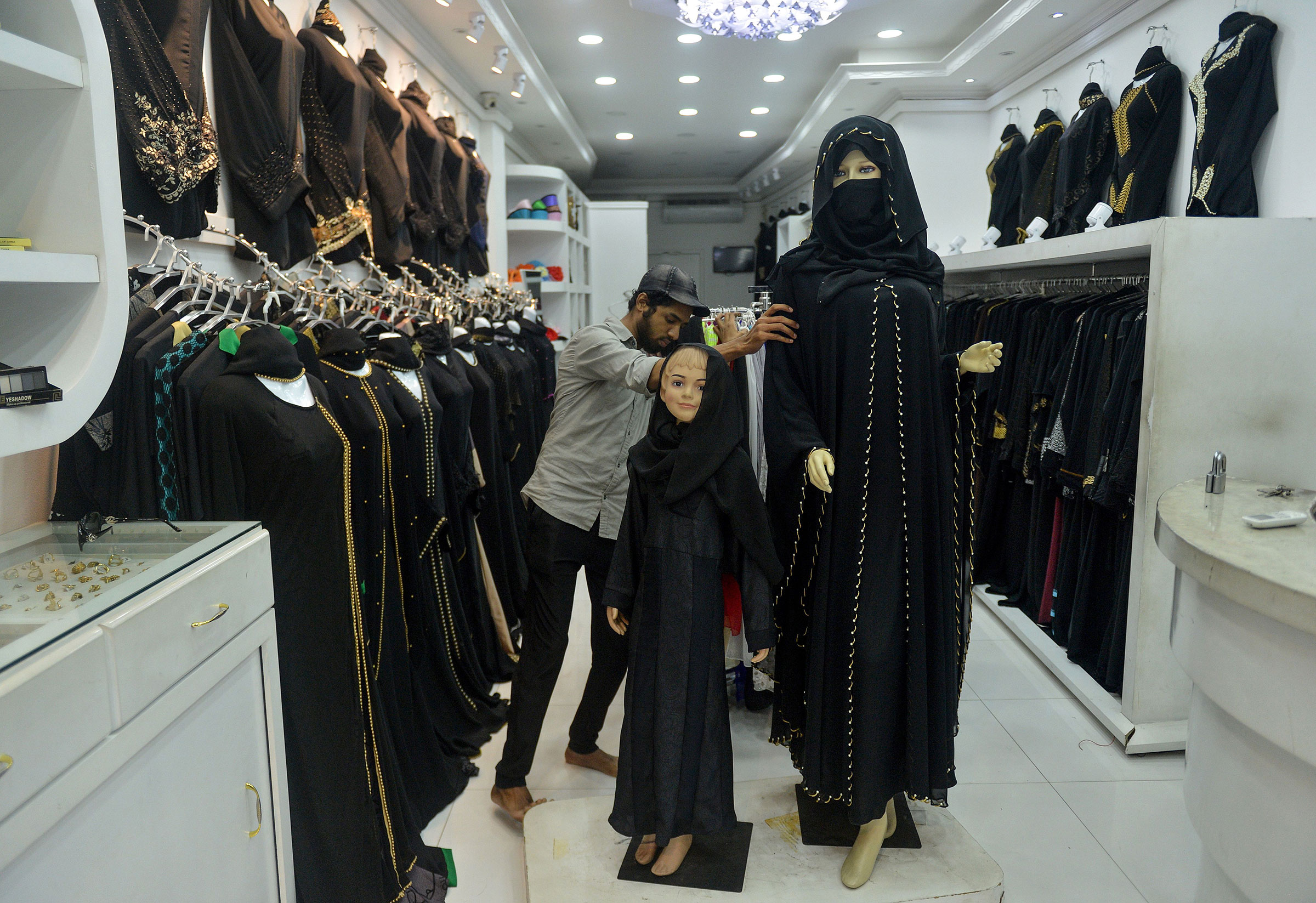 A Sri Lankan vendor shows a full face veil, called a niqab, at a shop selling clothes for Muslim women in Colombo on April 30, 2019. Religious tensions and a government ban on covering the face since the Easter Sunday suicide attacks have forced conservative Muslim women in Sri Lanka to shun veils, head scarves and long robes in public. (Ishara S. Kodikara—AFP/Getty Images)
