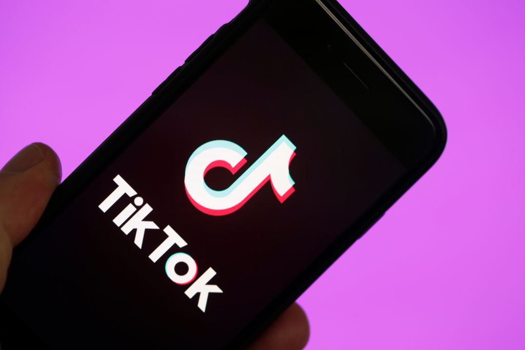 In this photo illustration, the social media application logo, Tik Tok is displayed on the screen of an iPhone  in Paris, France on March 5, 2019. (Chesnot/Getty Images)
