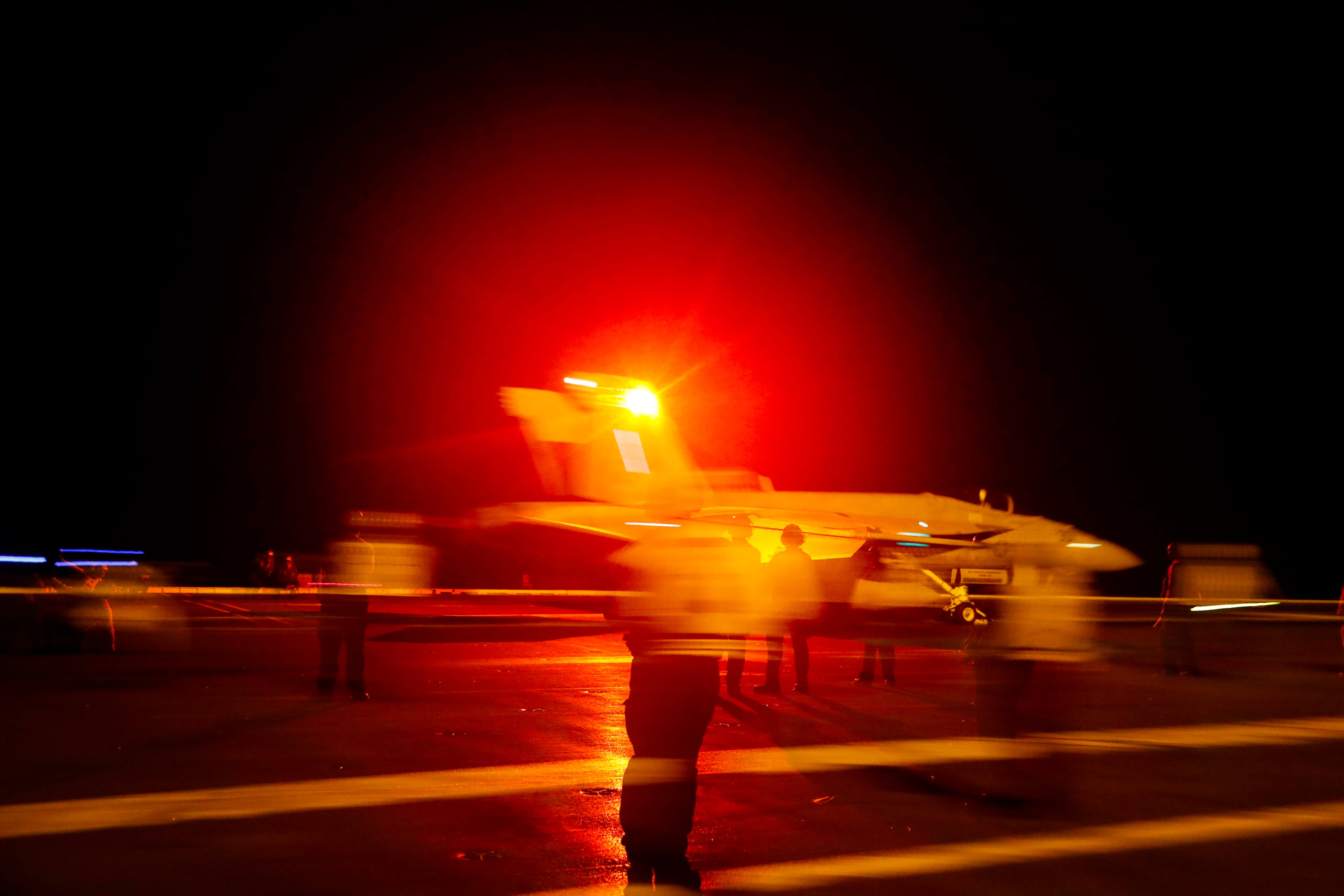 An F/A-18E Super Hornet aircraft launches from the flight deck the Nimitz-class aircraft carrier USS Abraham Lincoln in the Persian Gulf on May 10, 2019. The  aircraft carrier strike group is being deployed to the Persian Gulf to counter an alleged but still-unspecified threat from Iran. (Mass Communication Specialist Seaman Michael Singley—AP)