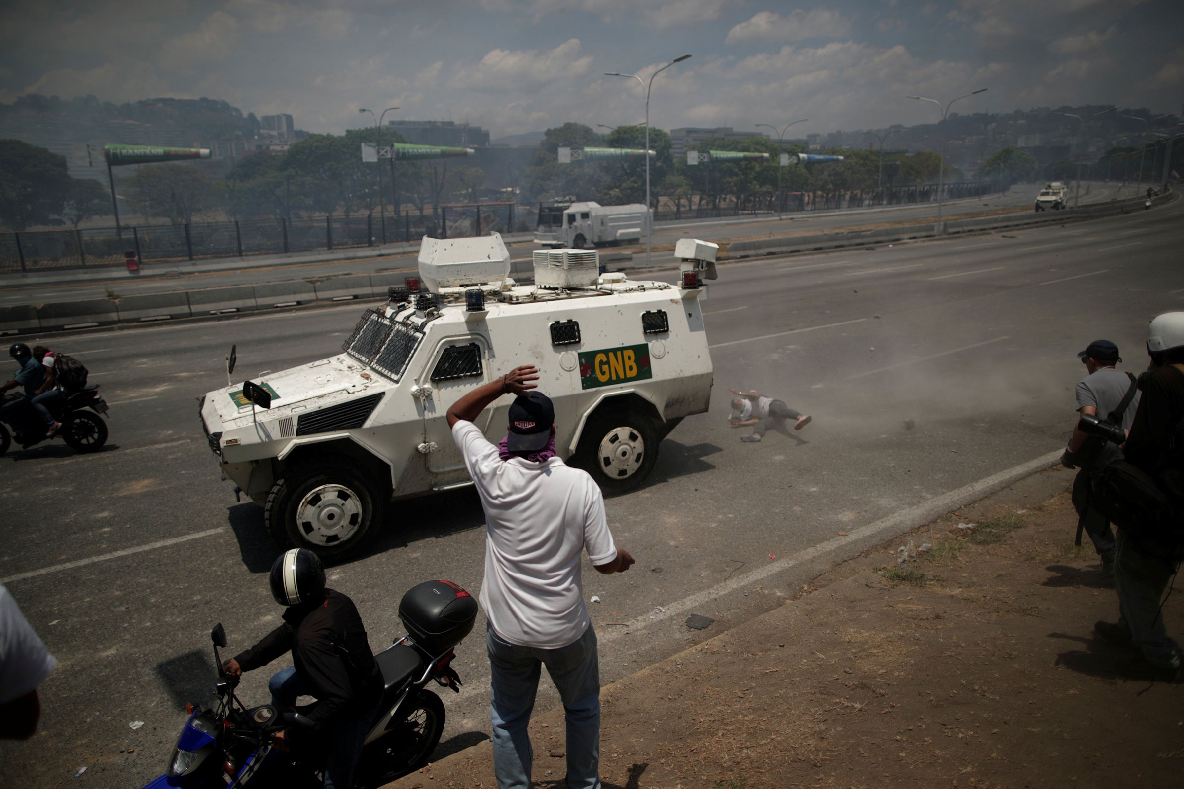 Amid the turmoil on April 30, a protester is hit by a Venezuelan National Guard vehicle in Caracas (Ueslei Marcelino—Reuters)