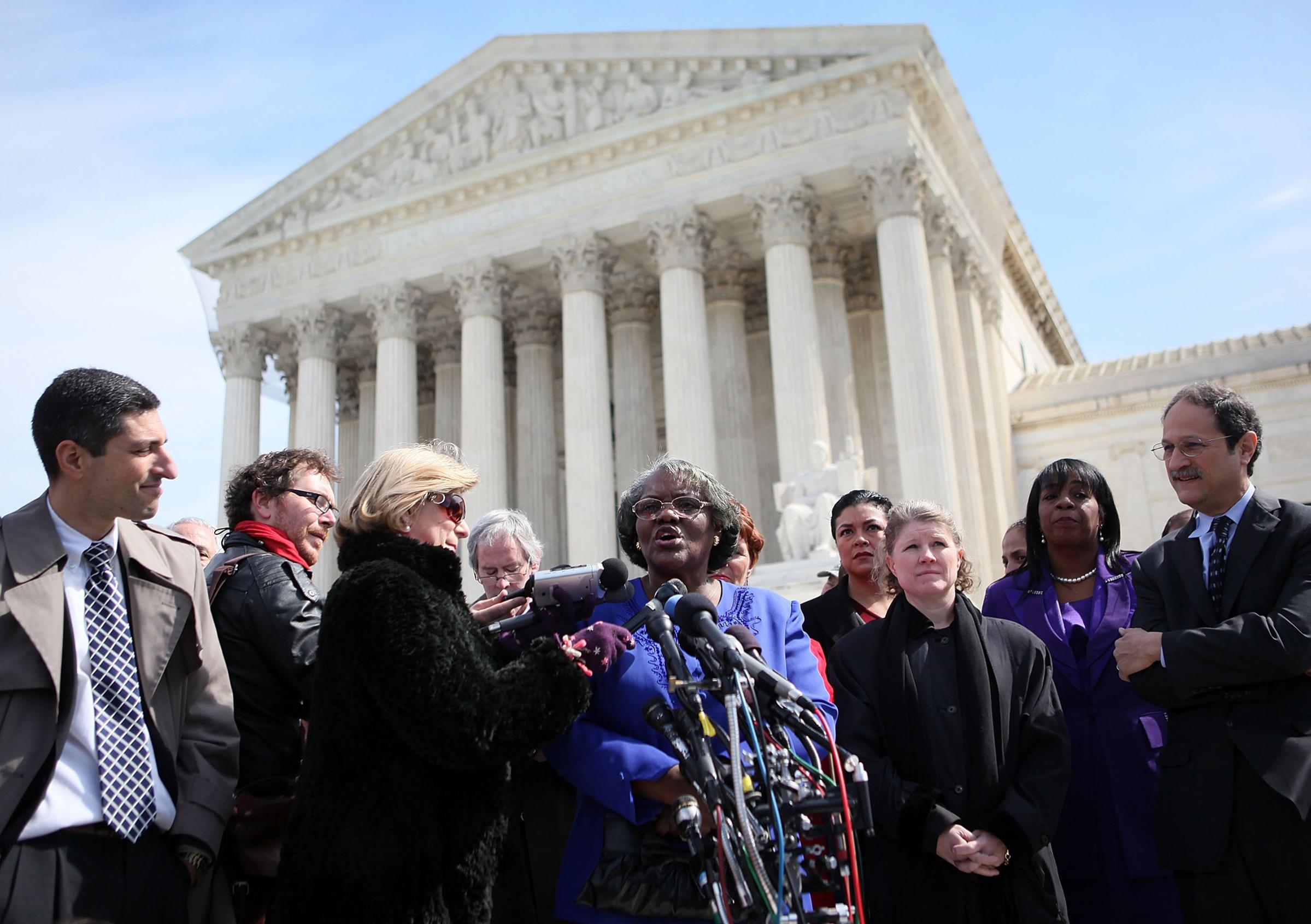 Betty Dukes, the lead plaintiff in the original class action, speaks in front of the Supreme Court in 2011