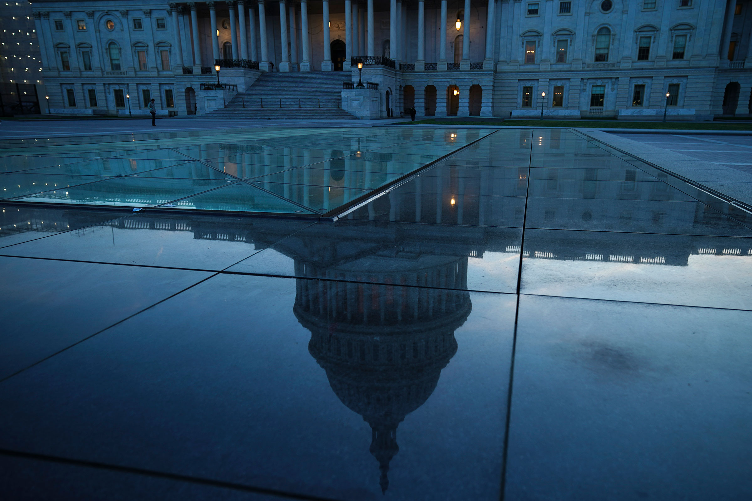The U.S. Capitol dome is reflected on the plaza of the East Front of the U.S. Capitol, in Washington, DC on April 17, 2019. (Drew Angerer—Getty Images)