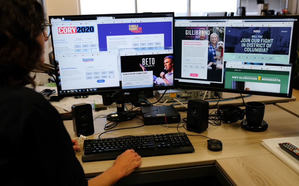 An editor looks at the campaign donations websites from some of the Democratic party candidates in the race for the White House 2020 in Hollywood on March 15, 2019. (Chris Delmas—AFP/Getty Images)