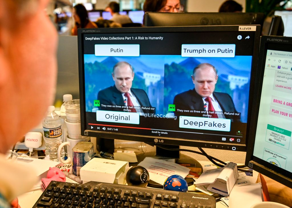 A man in Washington, DC views a video, on January 25, 2019, manipulated with artificial intelligence to potentially deceive viewers, or "deepfake." Deepfakes can be detected by closely examining videos. (ALEXANDRA ROBINSON&mdash;AFP/Getty Images)