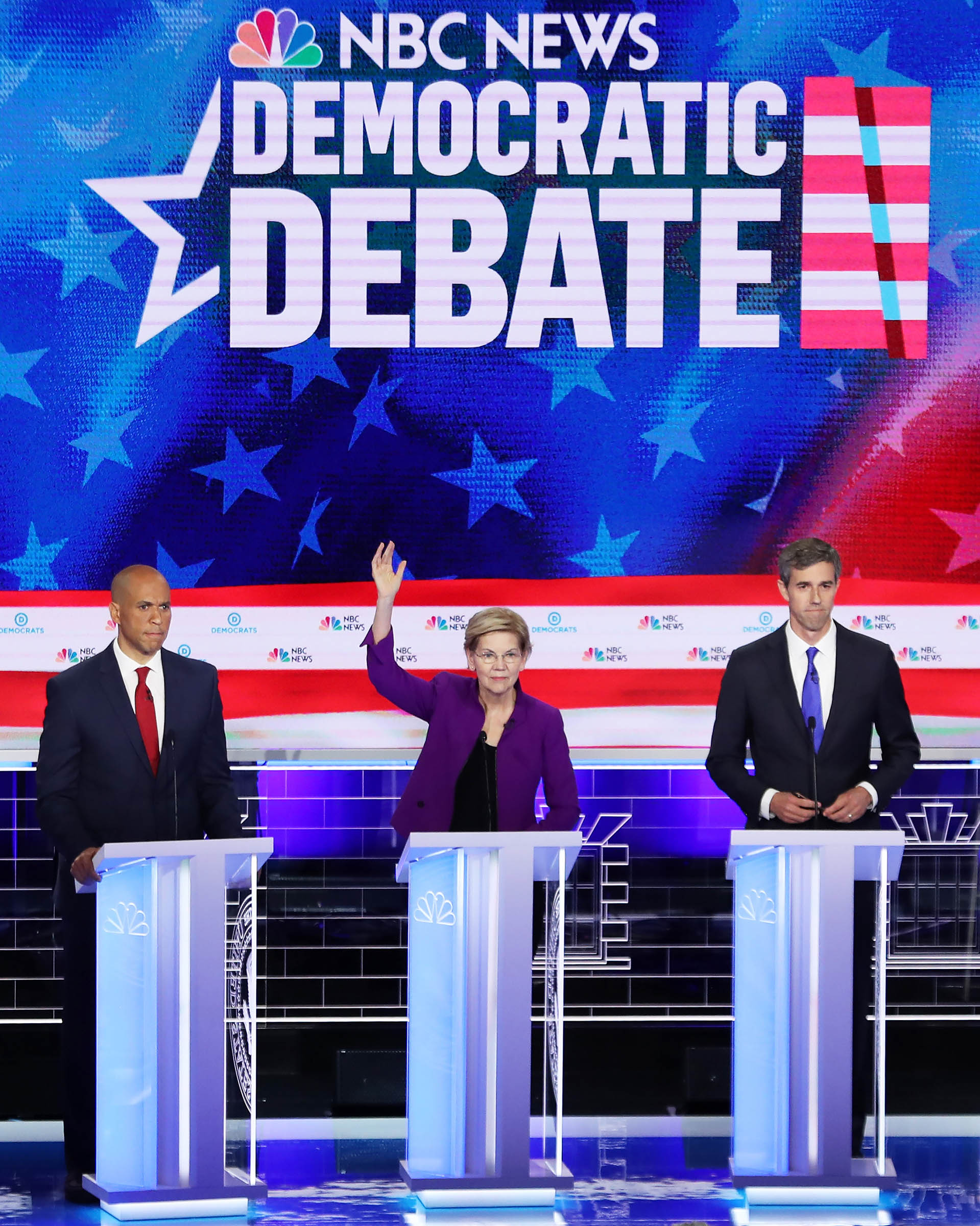 (L-R) Sen. Cory Booker (D-NJ), Sen. Elizabeth Warren (D-MA) and former Texas congressman Beto O'Rourke take part in the first night of the Democratic presidential debate on June 26, 2019 in Miami, Florida. (Joe Raedle—Getty Images)