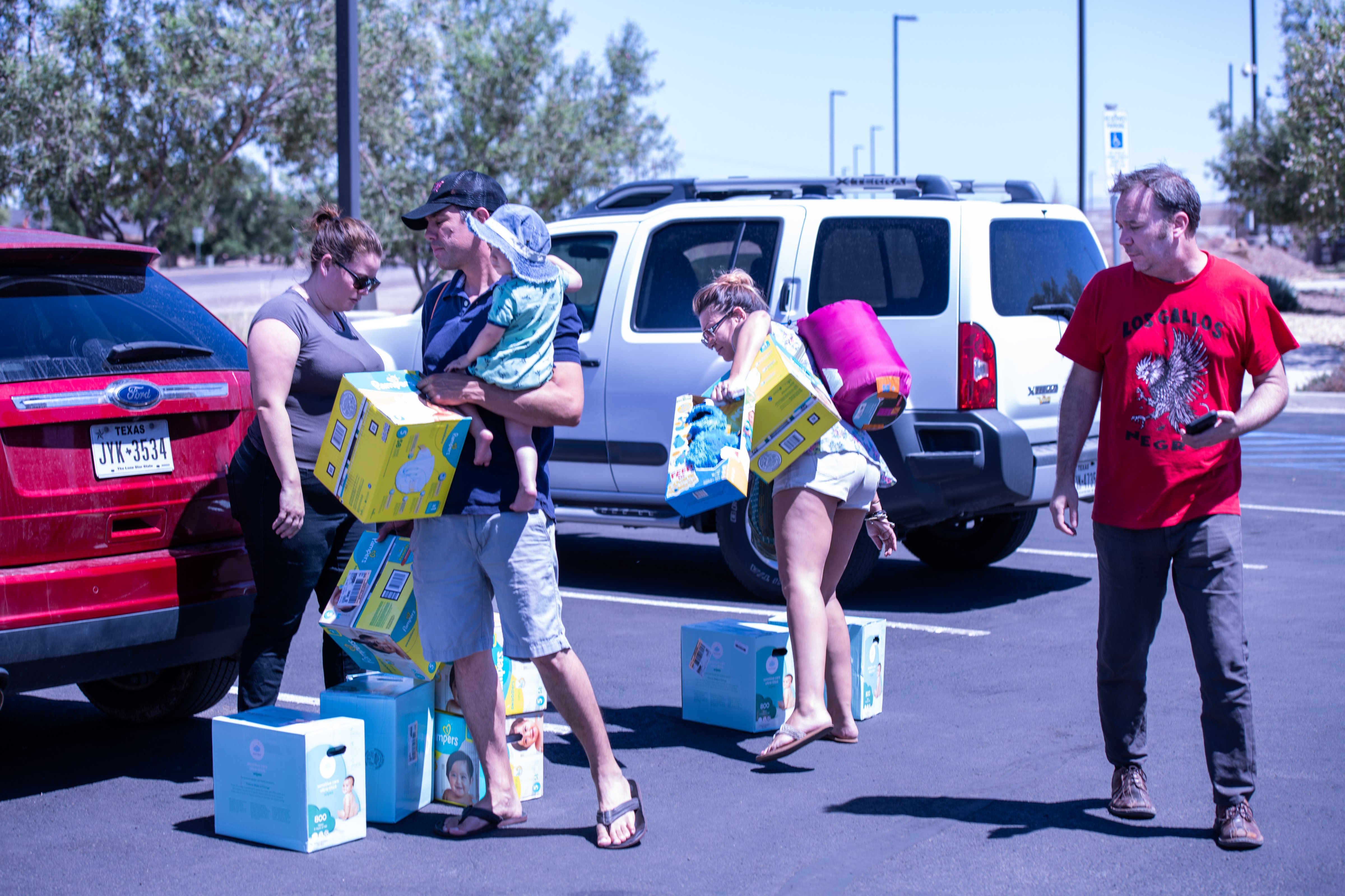 Andrew Savage (R) and donors attempt to deliver diapers and other goods to the Border Patrol facility in Clint, Texas housing child migrants on Sunday, June 23. (Courtesy Armando Martinez)