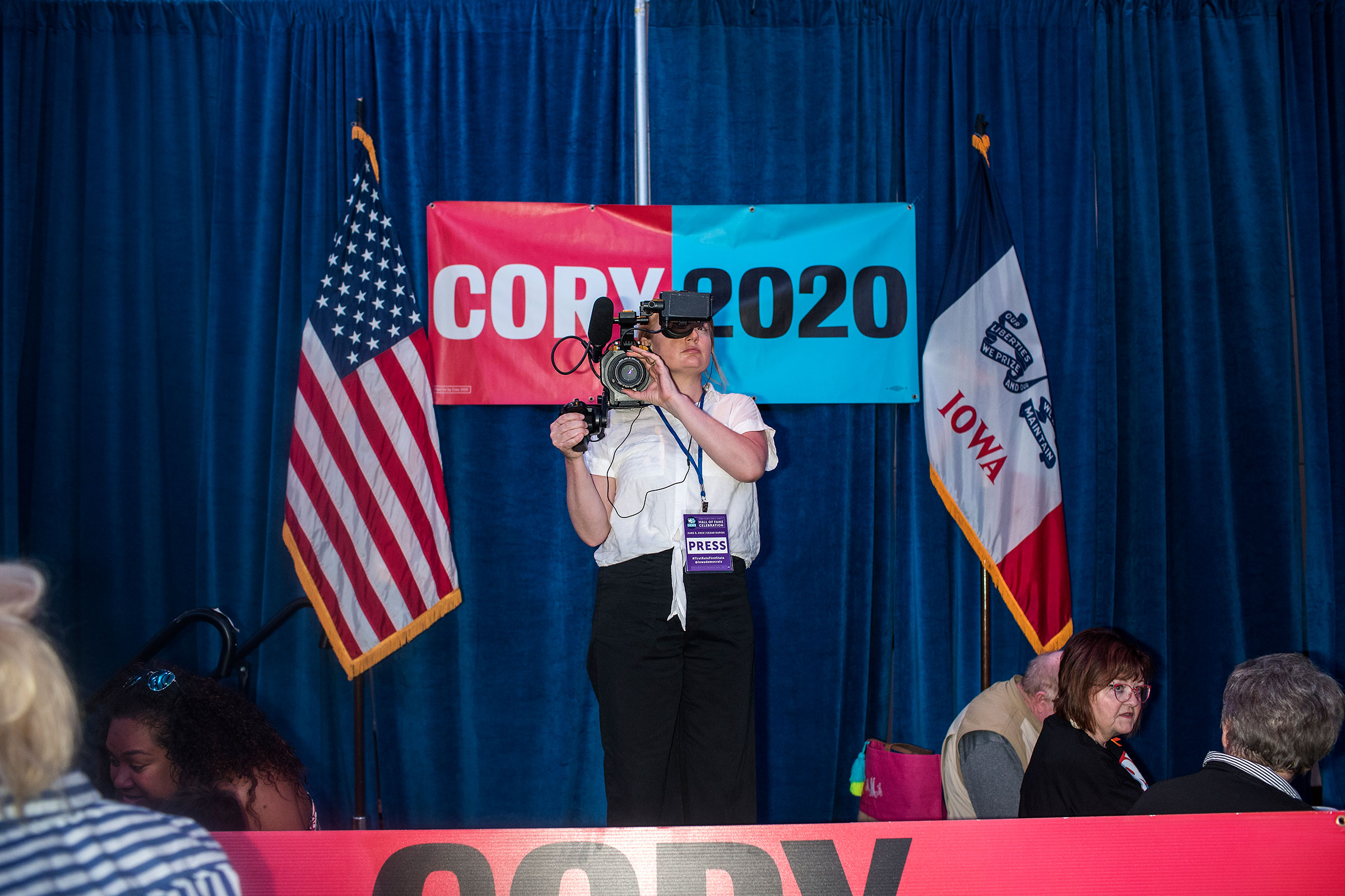A journalist records video before remarks by Senator Cory Booker in the Grand Ballroom of the Double Tree Cedar Rapids Convention Complex during the Democratic Hall of Fame event in Cedar Rapids, Iowa on June 9. (Danny Wilcox Frazier—VII for TIME)