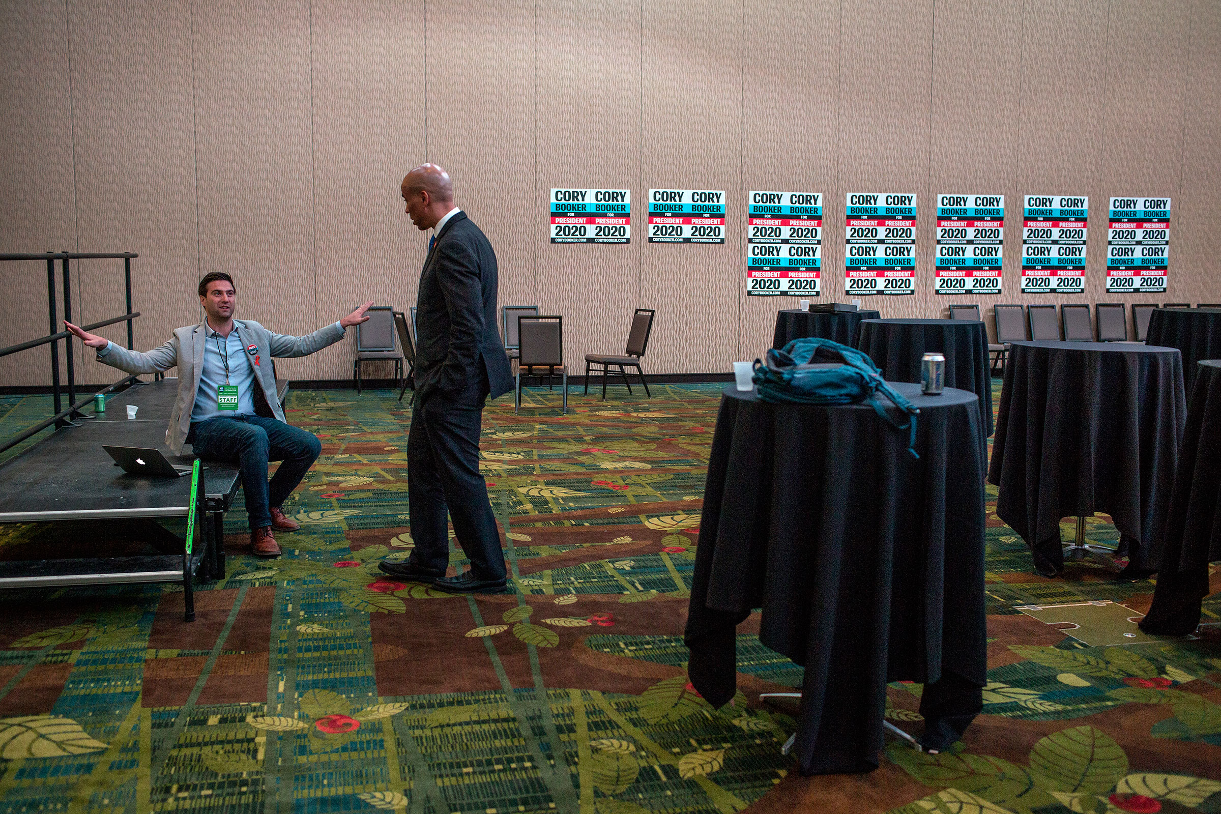 Booker speaks with Iowa State Director Mike Frosolone after a day of campaigning in the Grand Ballroom of the Cedar Rapids Double Tree Convention Complex following the Democratic Hall of Fame event on June, 9. (Danny Wilcox Frazier—VII for TIME)